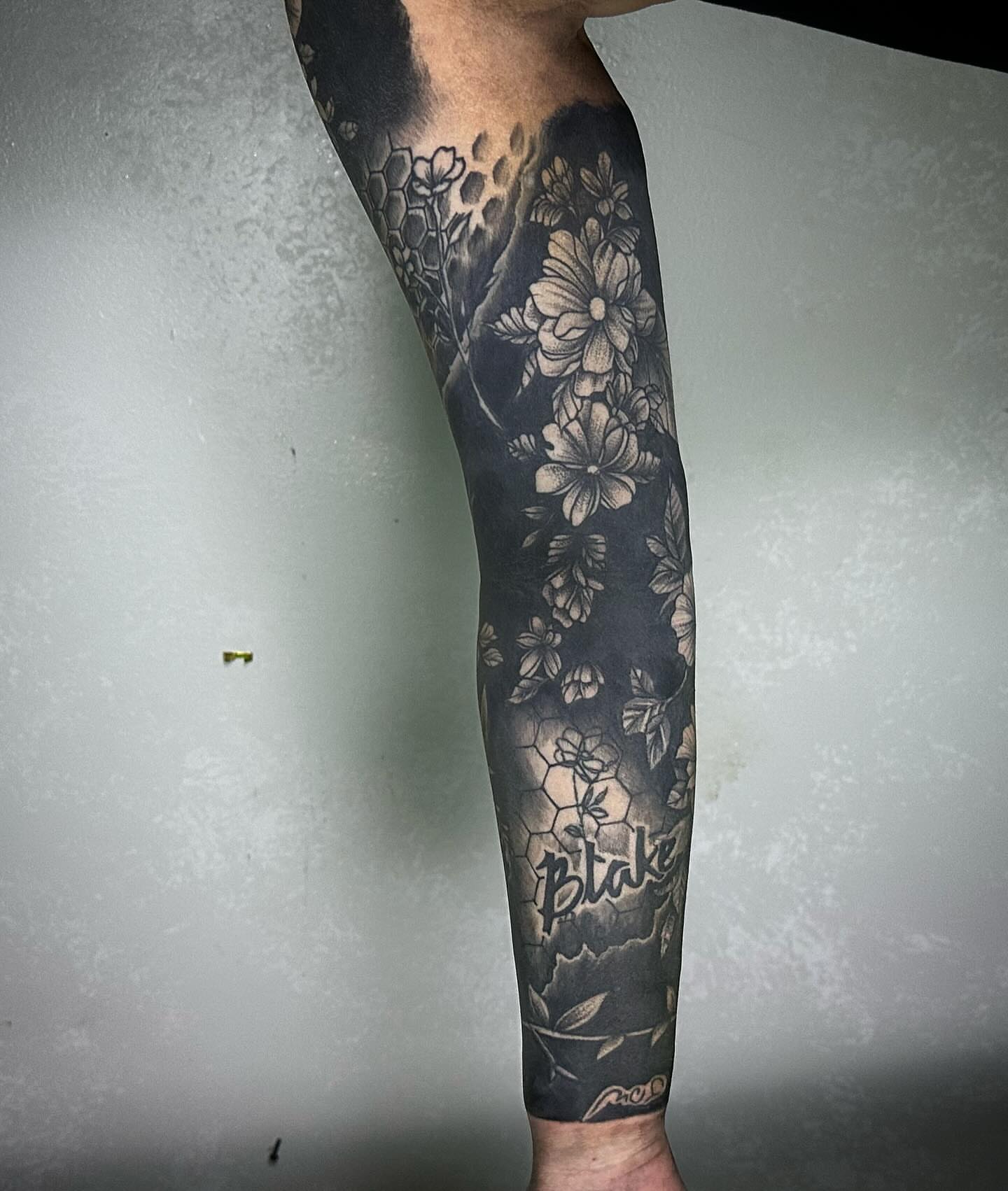 Floral bouquet realism tattoo on the forearm by Neil5one3