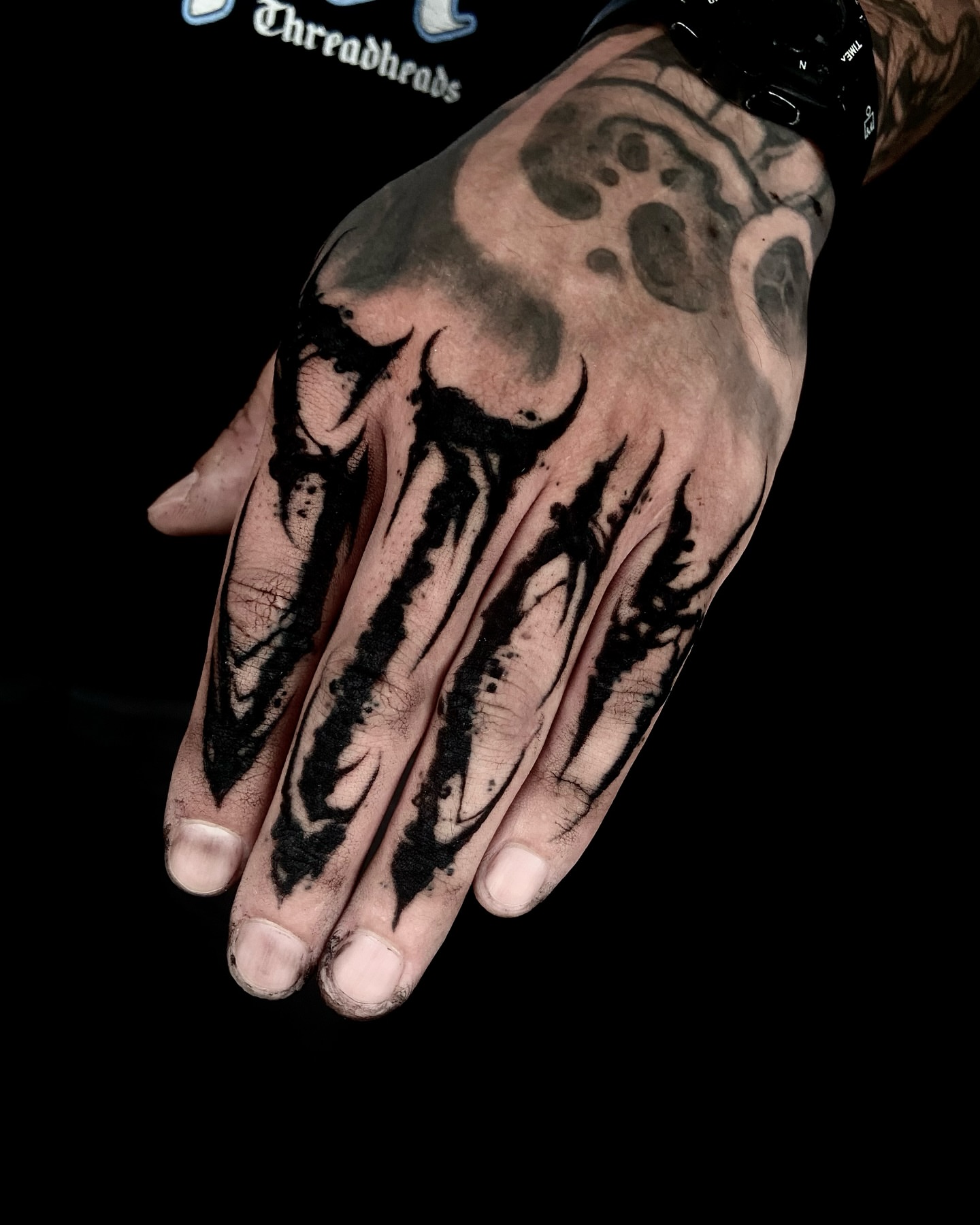 Abstract design black and grey tattoo on the hand by Nathan