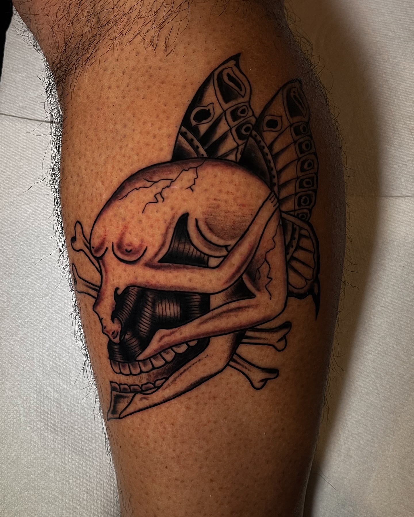 Skull and shark realism tattoo on the forearm by Miguel Henrik