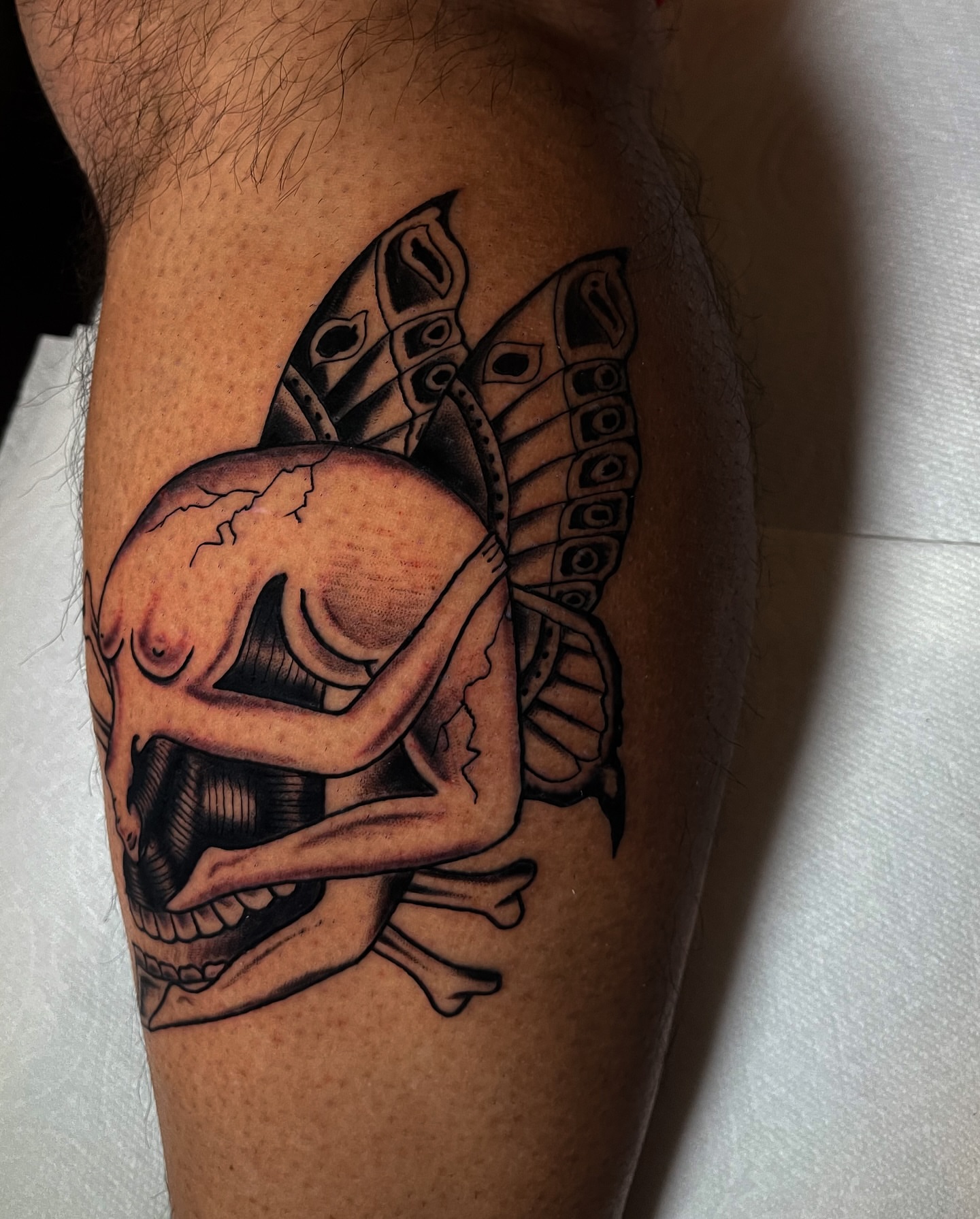 Skull with tentacles realism tattoo on the forearm by Miguel Henrik