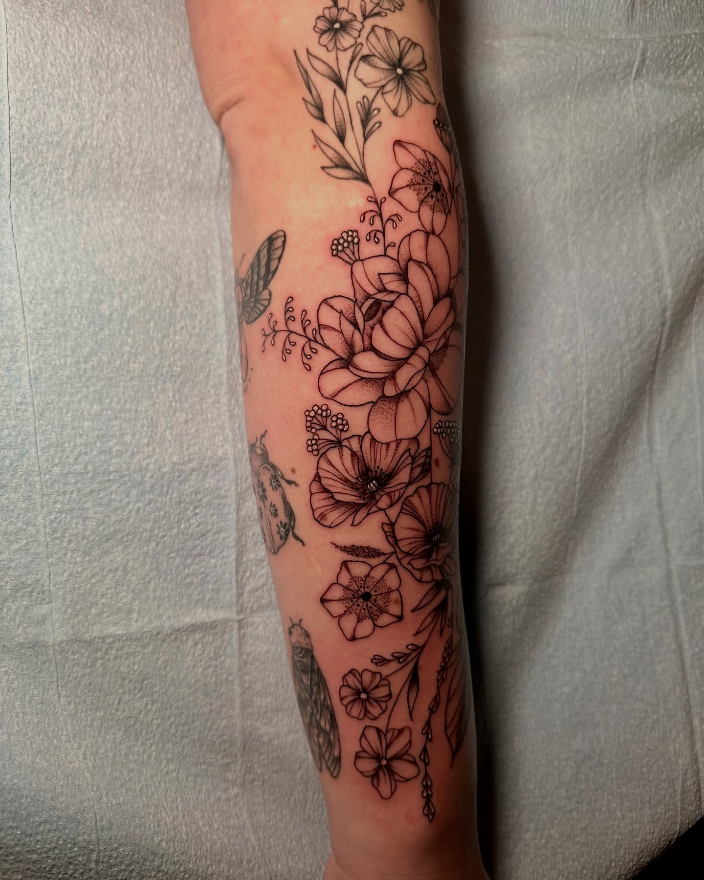 Floral arrangement black and grey tattoo on the forearm by Abby ✣ fineline and blackwork ✣