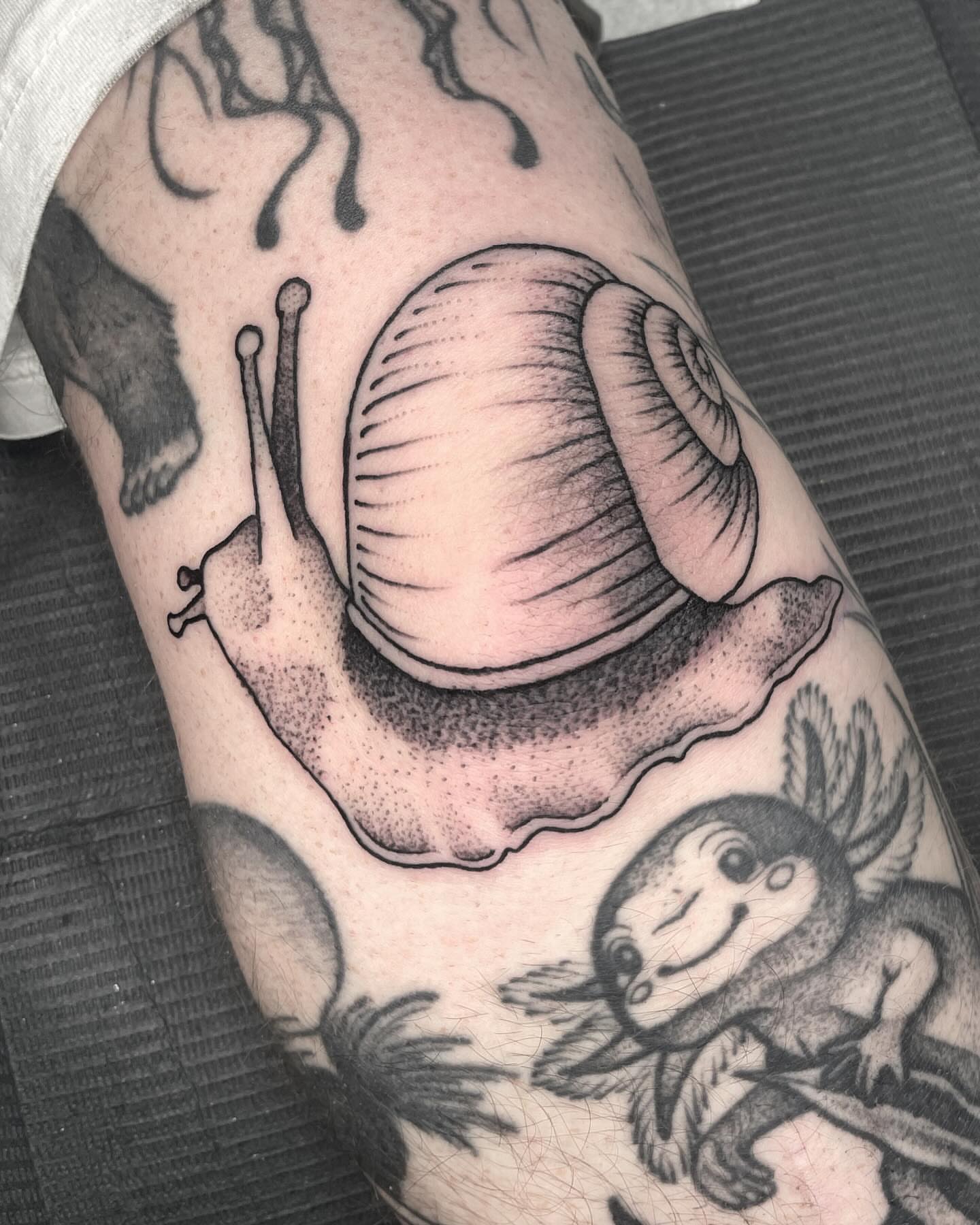 Snail dotwork tattoo on the forearm by Amanda Marie, Edmonds, Washington