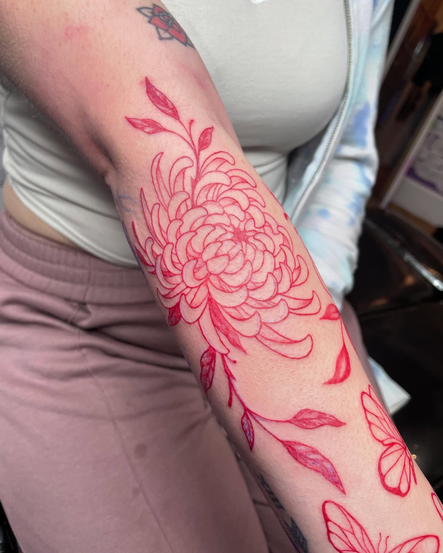 Chrysanthemum fine line tattoo on the forearm by Christin Baumgart