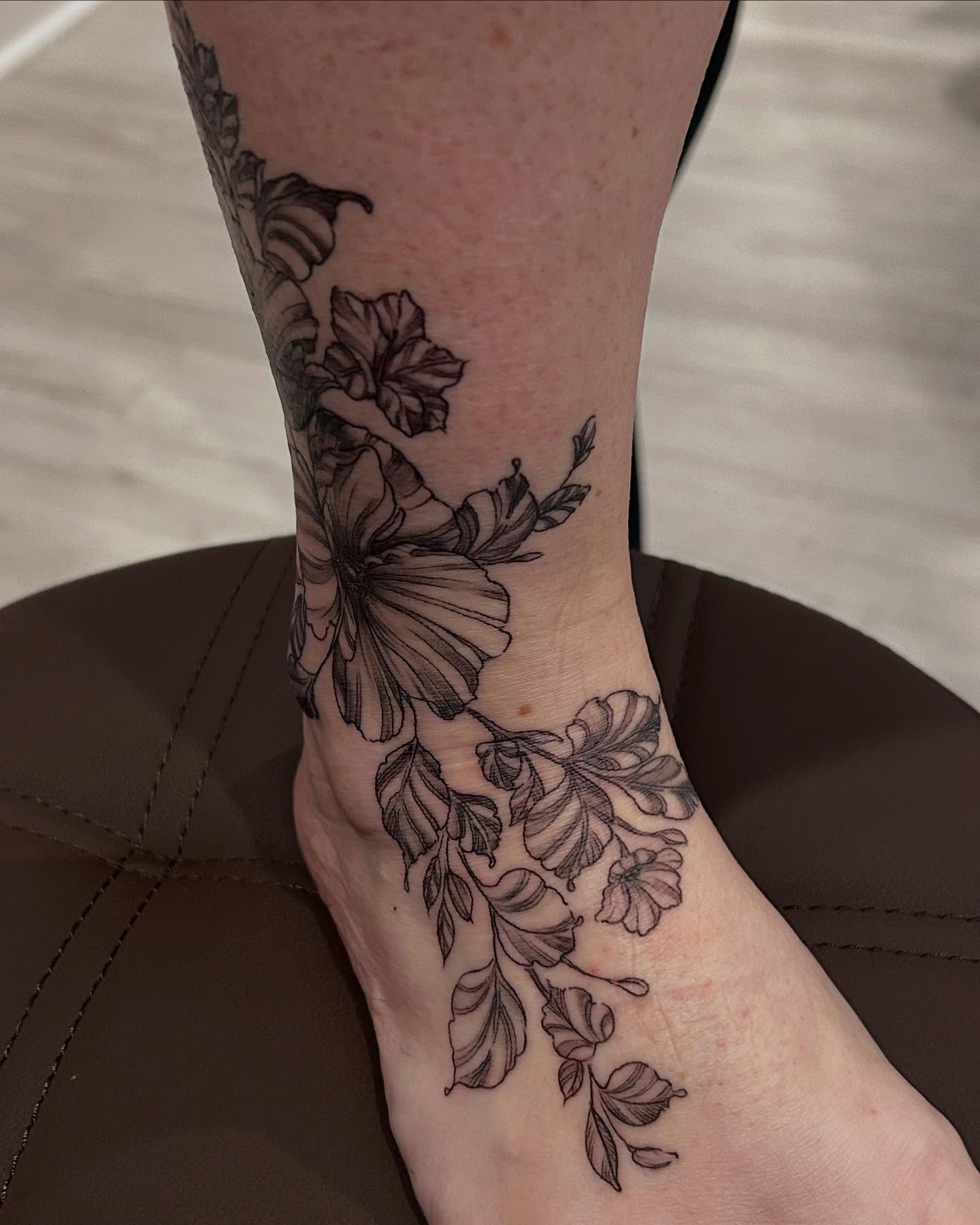 Floral vine black and grey tattoo on the foot by Jbtattoo Artistry