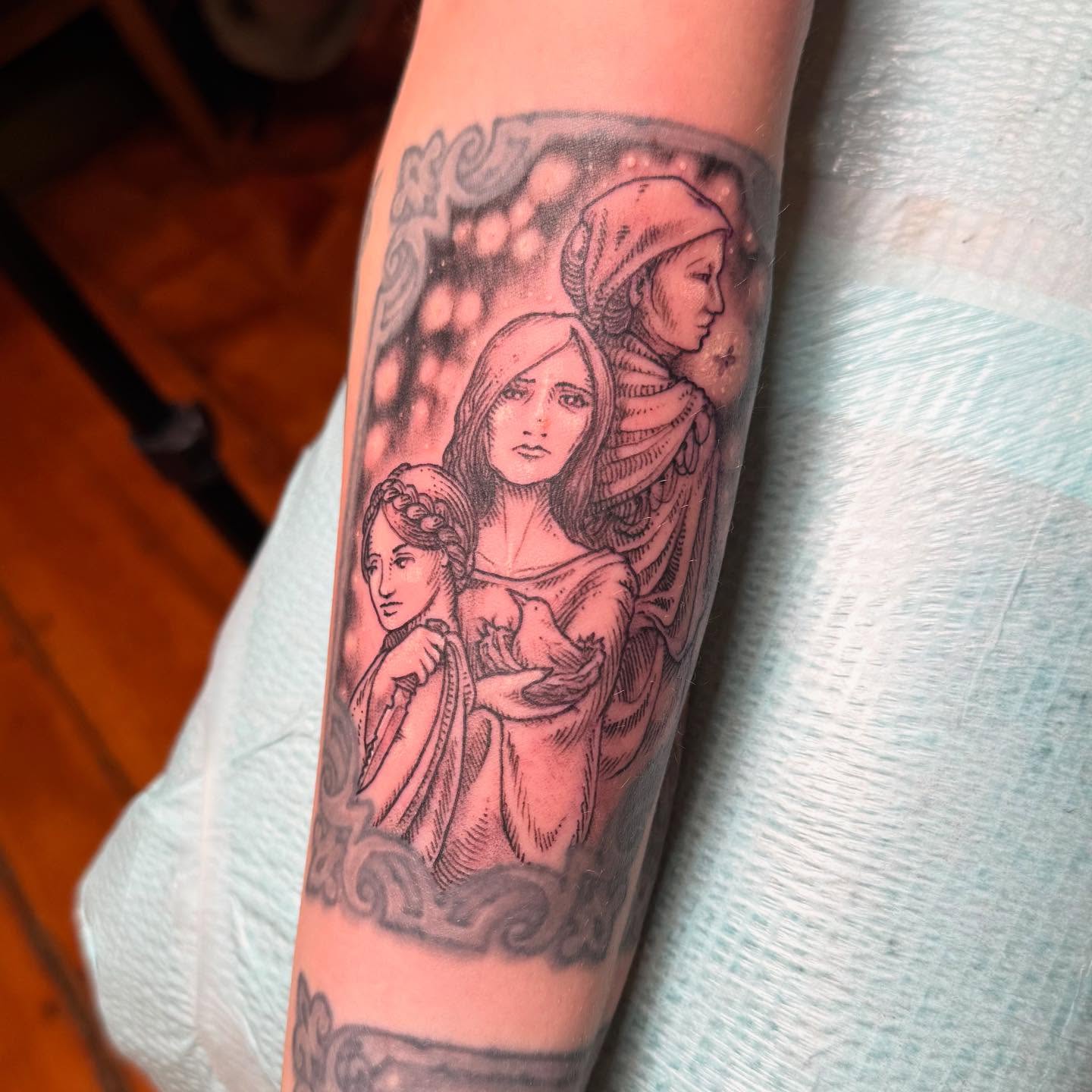 Three women black and grey tattoo on the forearm by Rebeka Chase [Sobodacha]