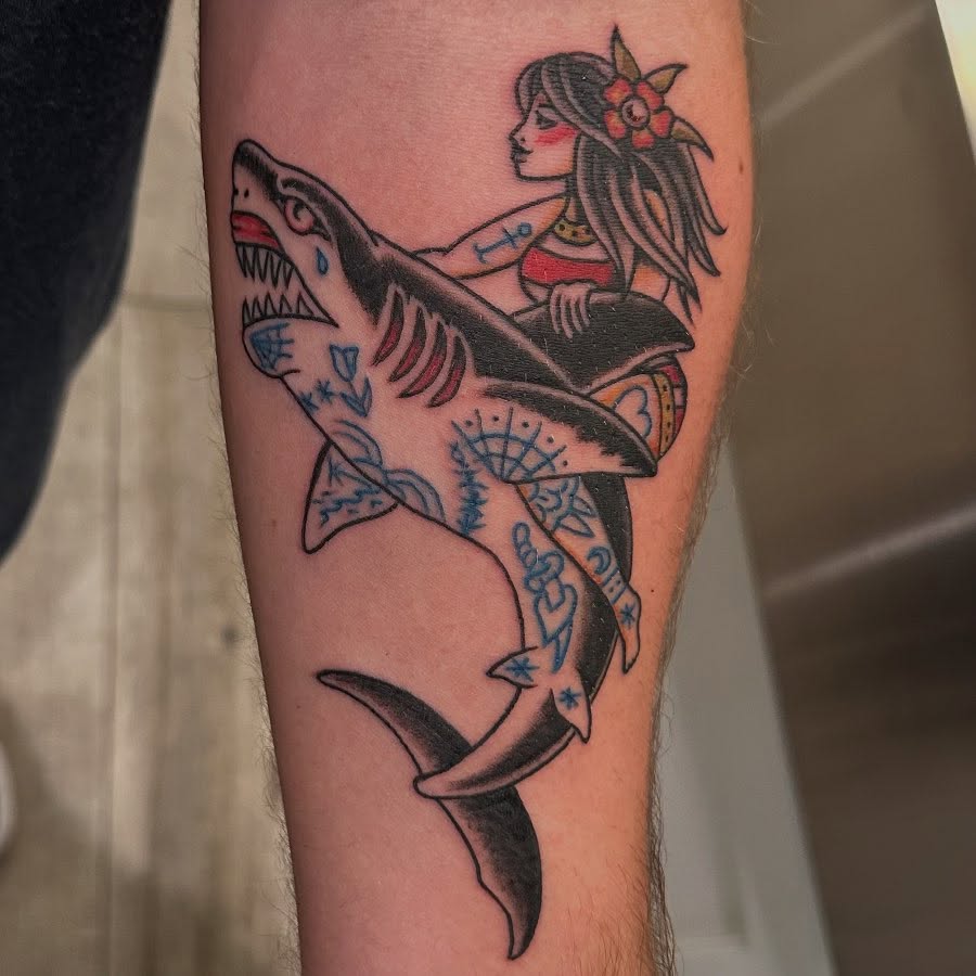 Shark and woman American traditional tattoo on the forearm by 𝕯𝖗𝖆𝕶𝖊㋛
