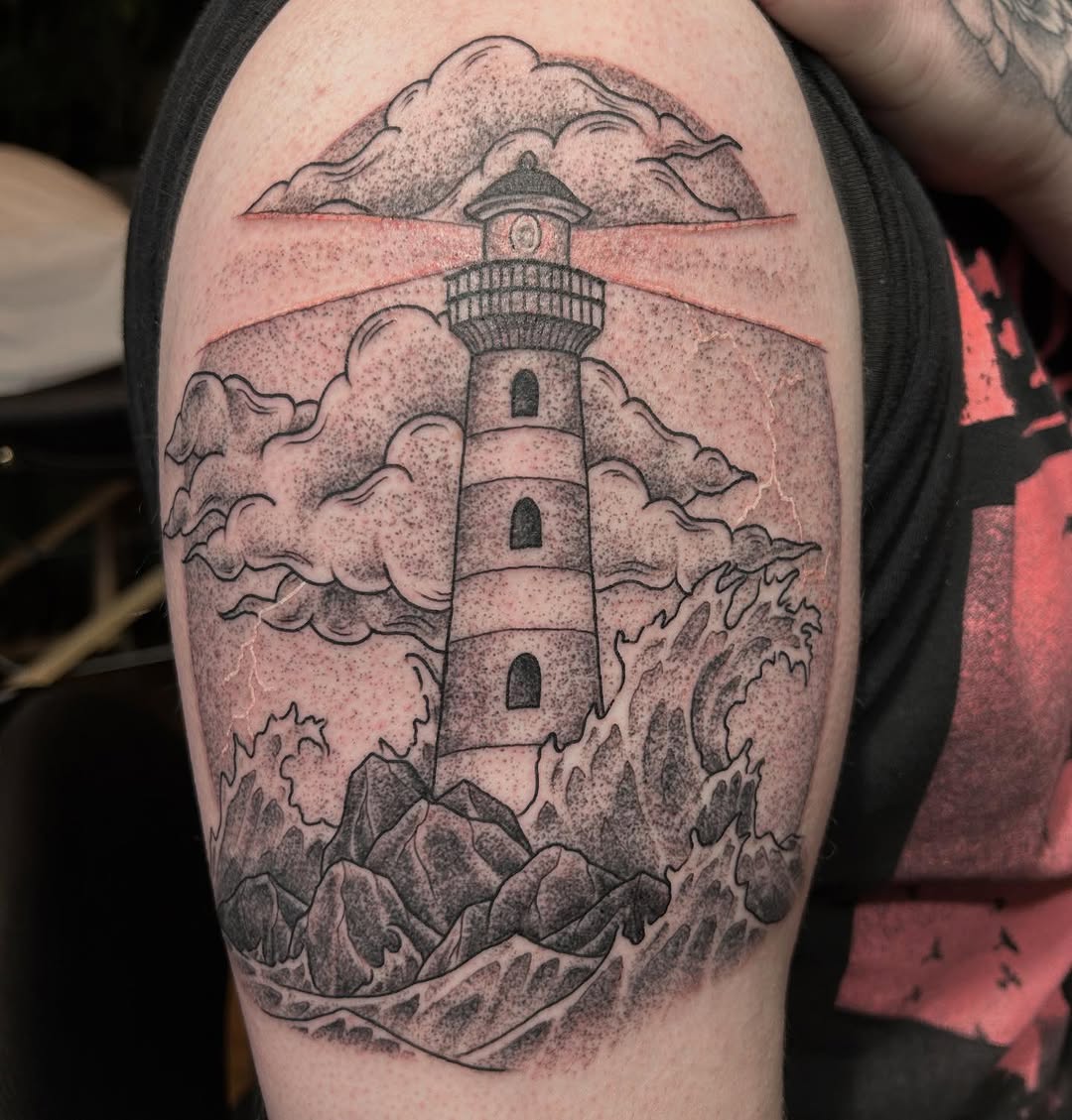 Lighthouse in a storm dark art tattoo on the forearm by Jaime Gaiti