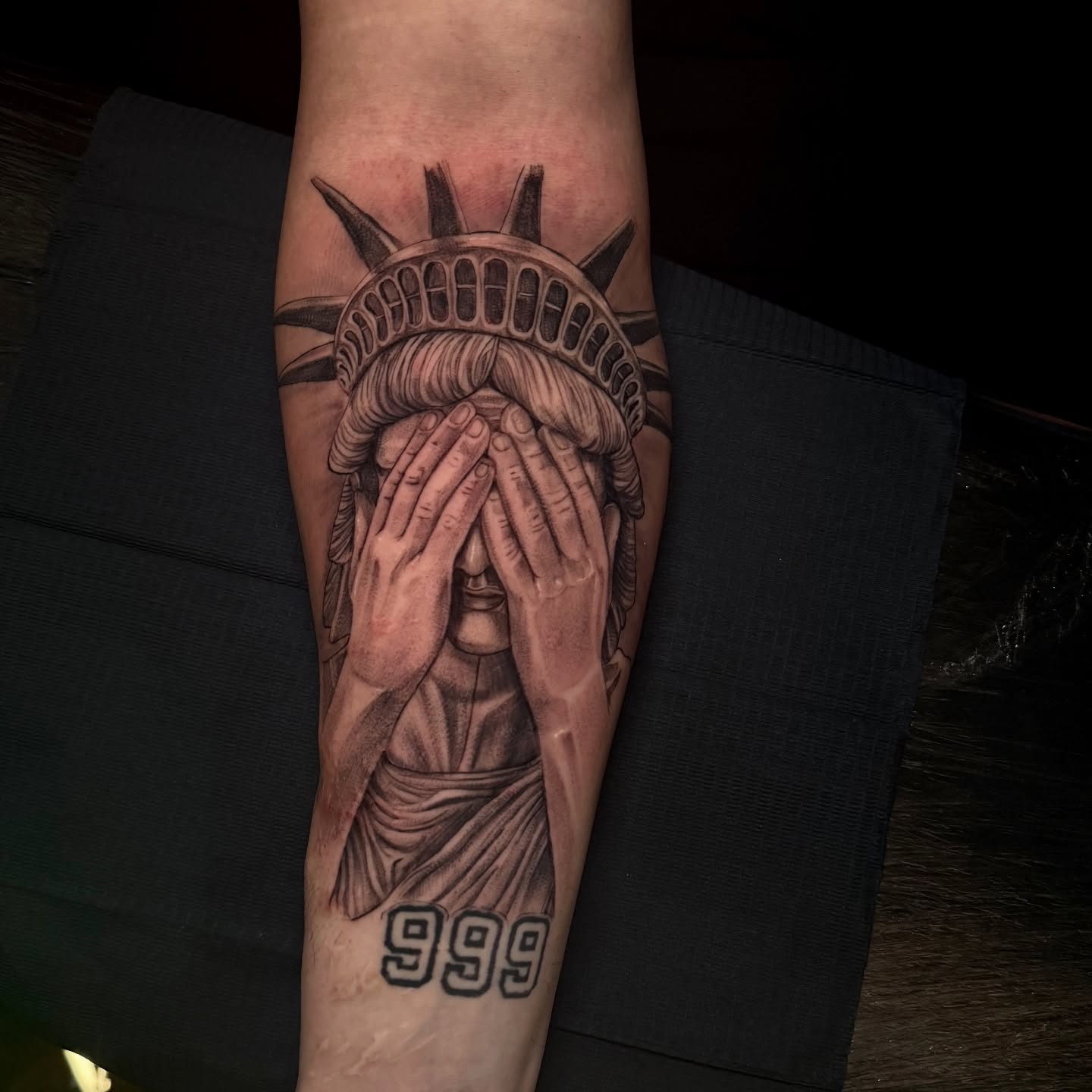 Statue of liberty realism tattoo on the forearm by Tattoo Artist