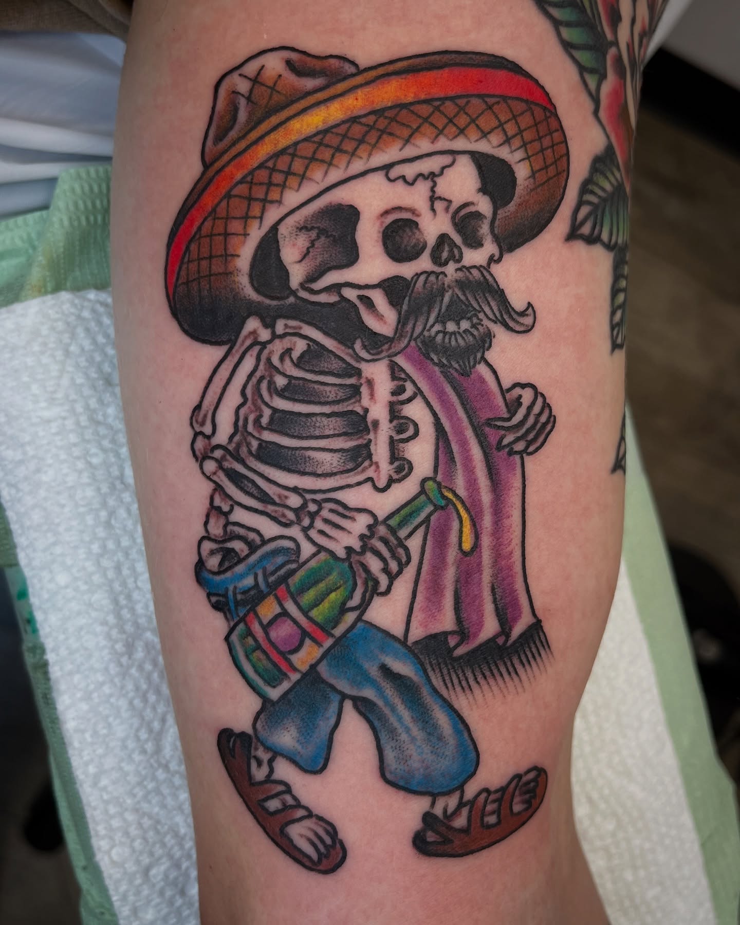 Skeleton playing drum American traditional tattoo on the forearm by Steve Tiberi