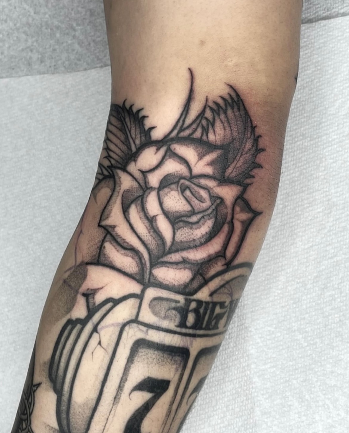 Rose and baseball glove realism tattoo on the forearm by Joon 치카노레터링