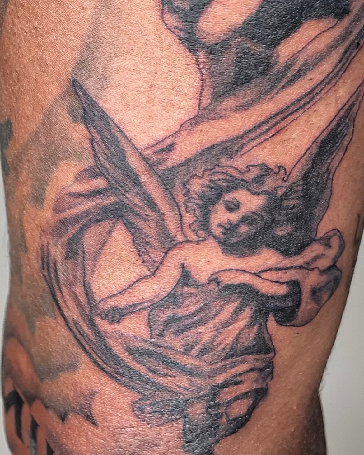 Cherub black and grey tattoo by Koolz