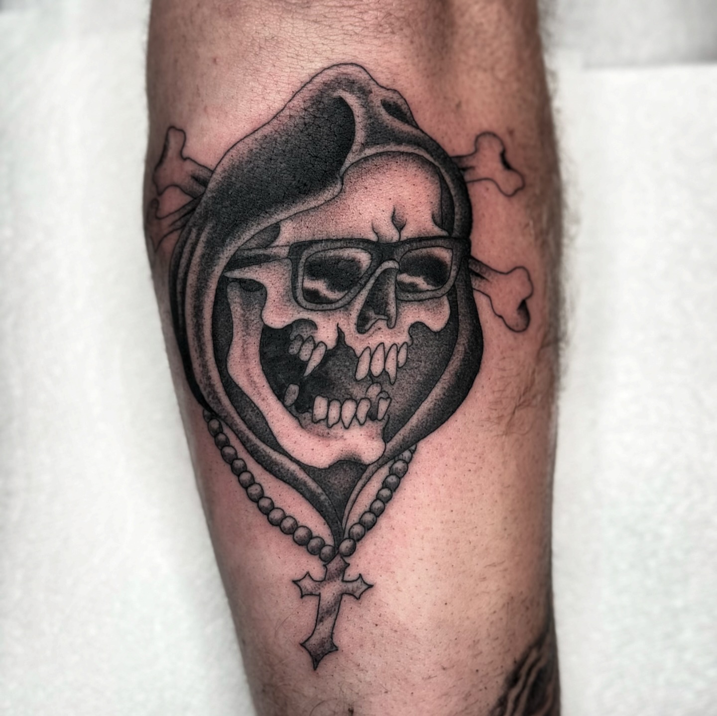 Skull with glasses realism tattoo on the forearm by Domanick Libretti, Nashville, Tennessee