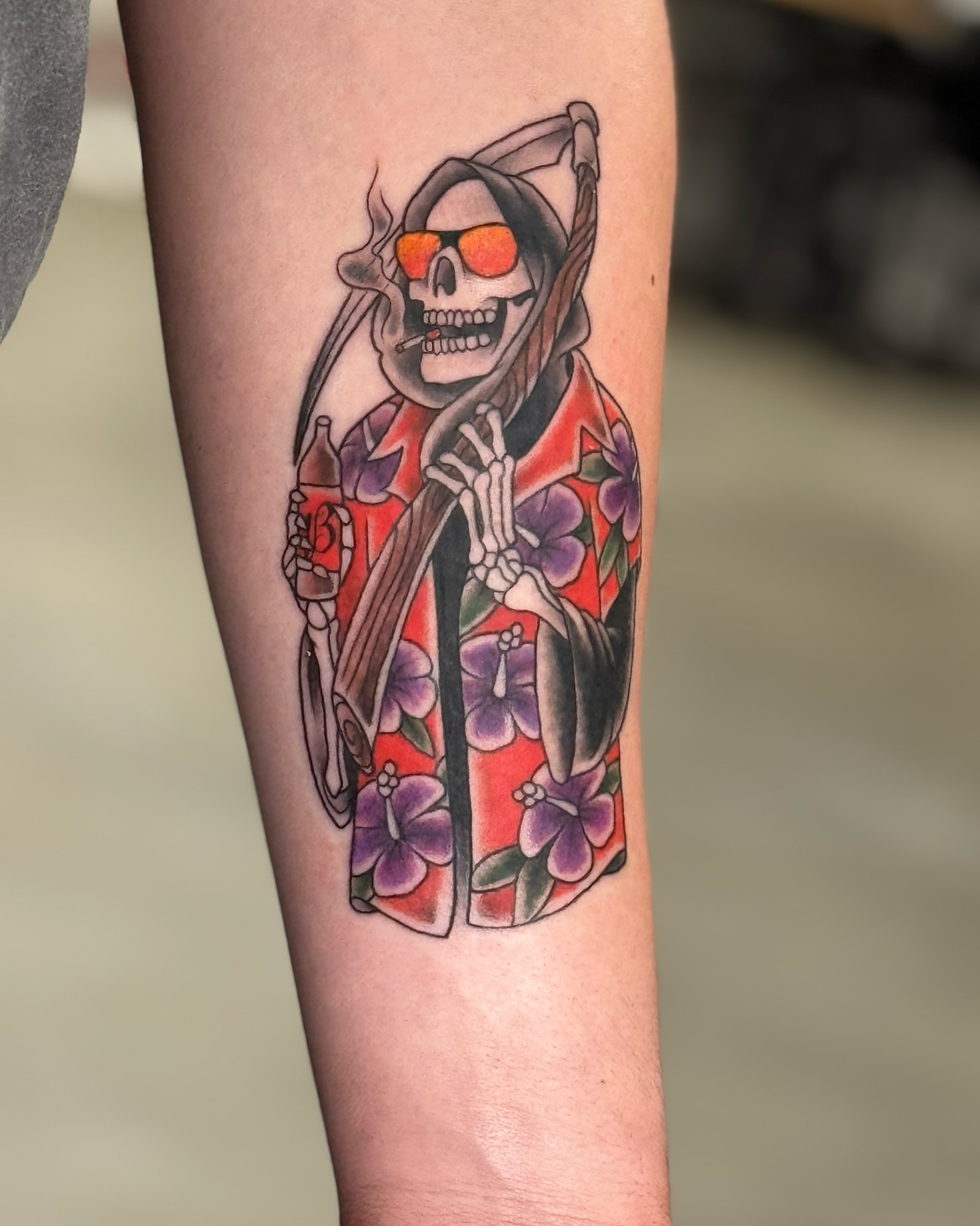 Skull in sunglasses new school tattoo on the forearm by Cory Perry-Servellon