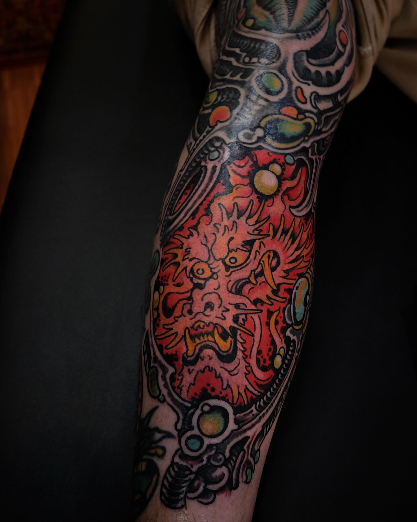 Dragon new school tattoo on the forearm by Zac Blevins