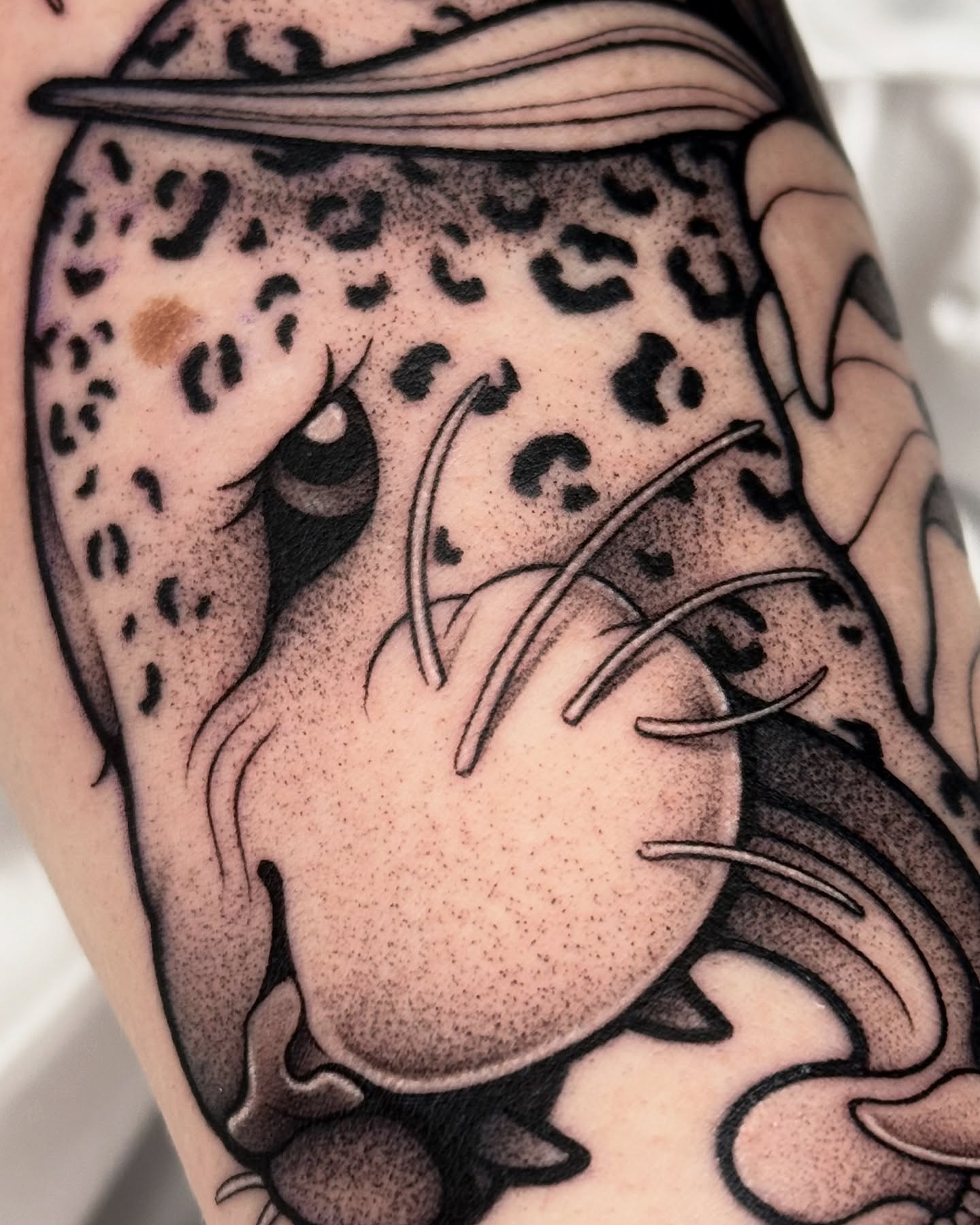 Cheetah dotwork tattoo on the forearm by Gabrieli Folha