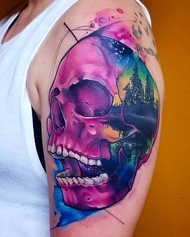 Skull watercolor tattoo on the shoulder by Jorell Elie