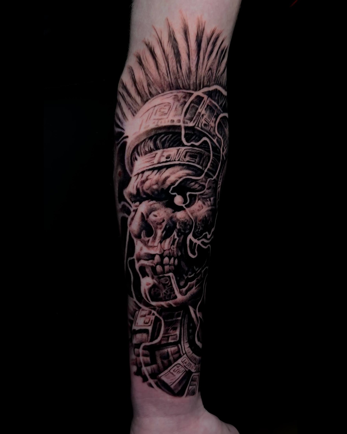 Skull with headdress realism tattoo on the forearm by Dark Shadows Tattoo
