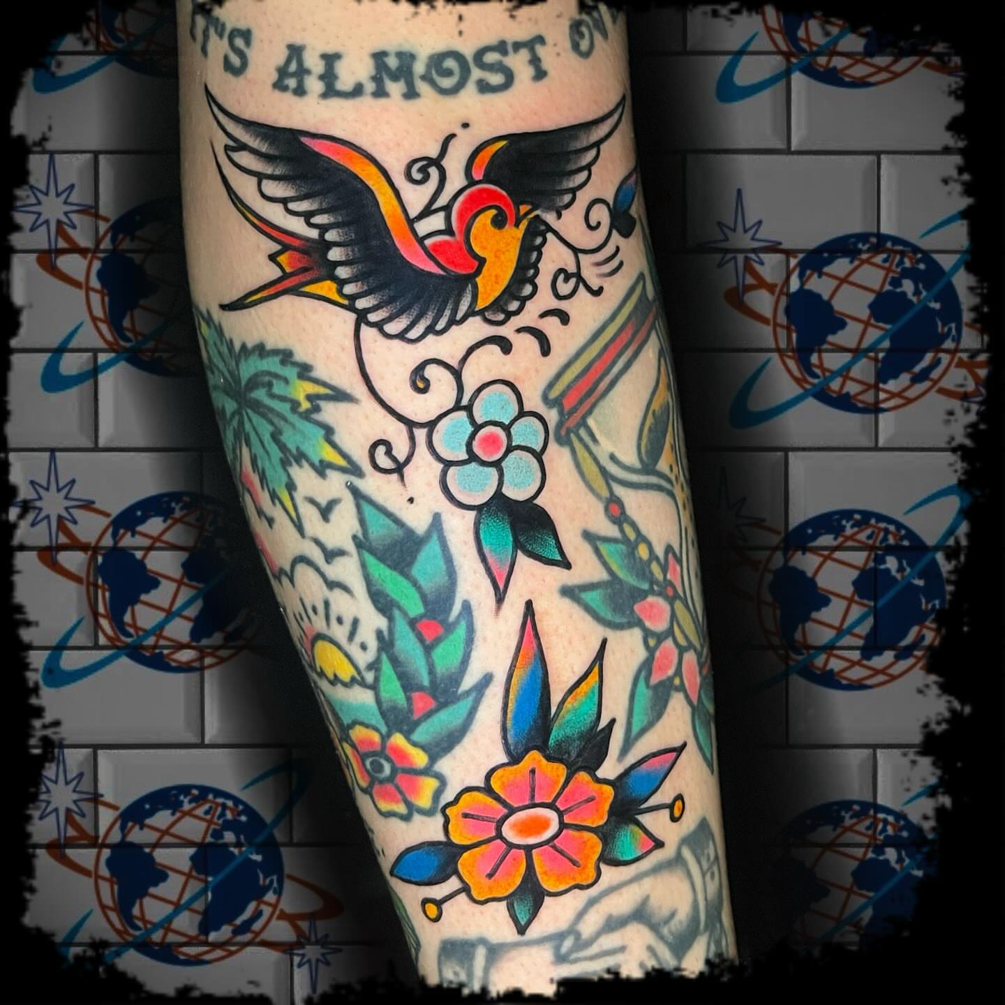 Bird and flowers American traditional tattoo on the forearm by Antonio DeCaro