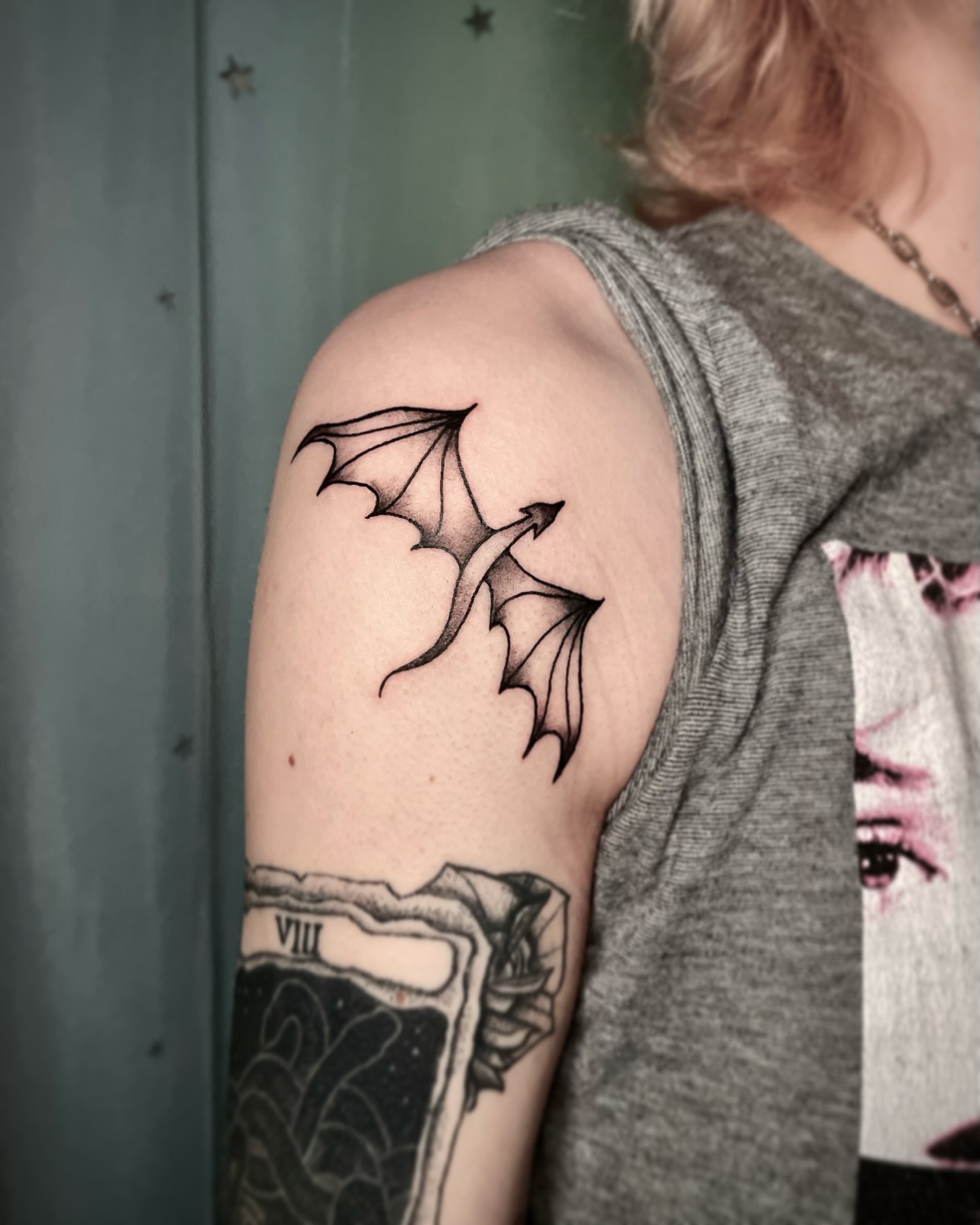 Bat black and grey tattoo on the shoulder by Liv