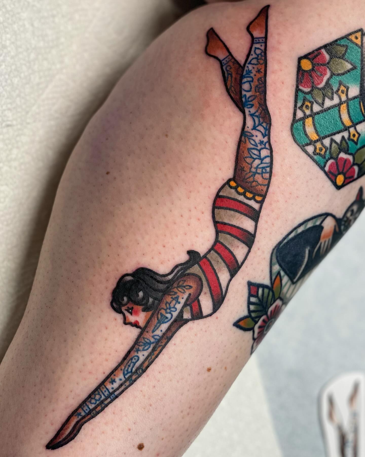 Mermaid American traditional tattoo on the forearm by Dakota Amato
