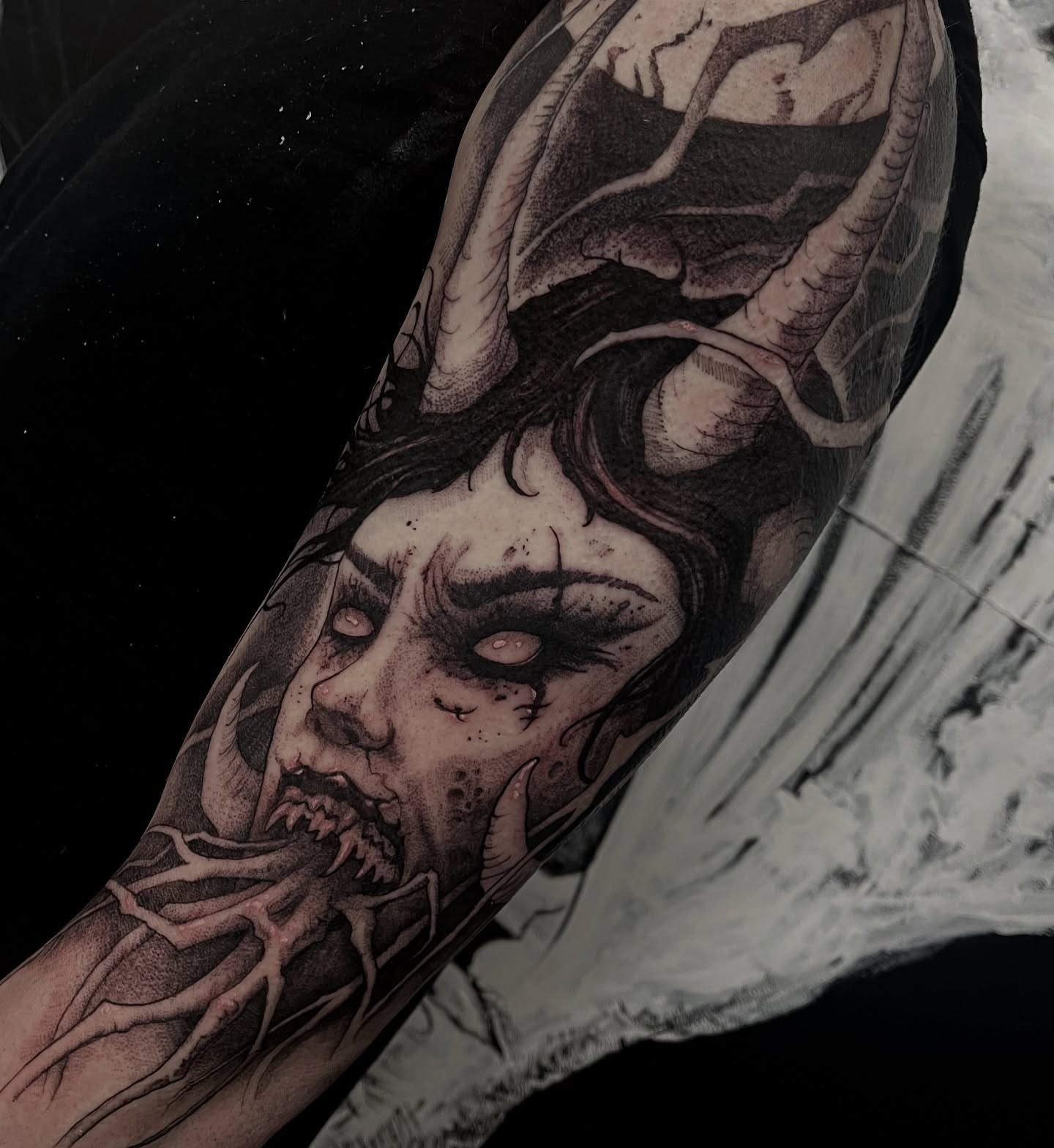 Tattoo by @bloodstonetattoos — dark_realism, black_and_grey