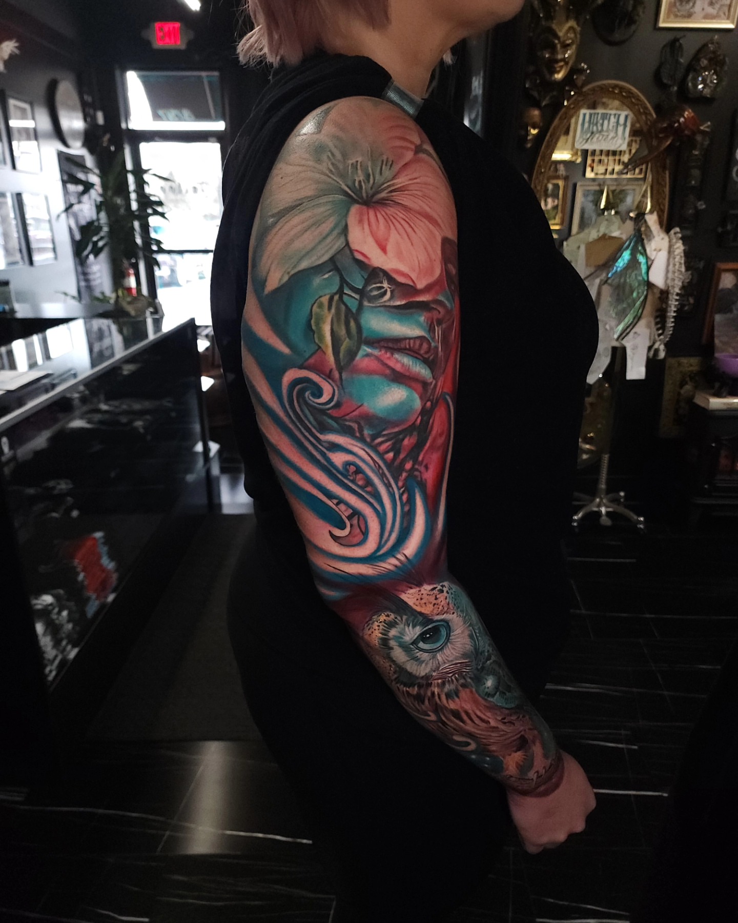 Owl and floral new school tattoo on the forearm by Color Realism Tattoos - Metro Detroit