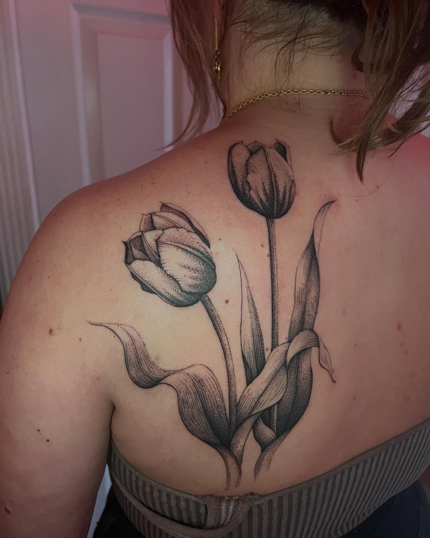 Tulips dotwork tattoo on the back by Natasha