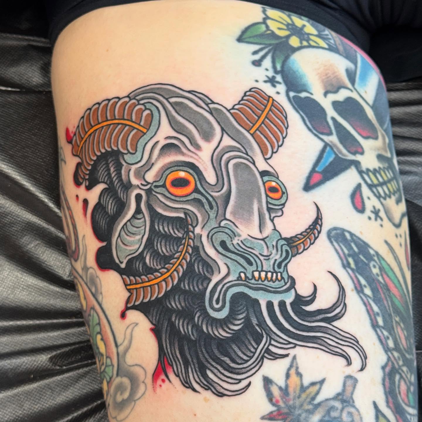 Demon skull American traditional tattoo on the thigh by Derek Noble, San Francisco, California