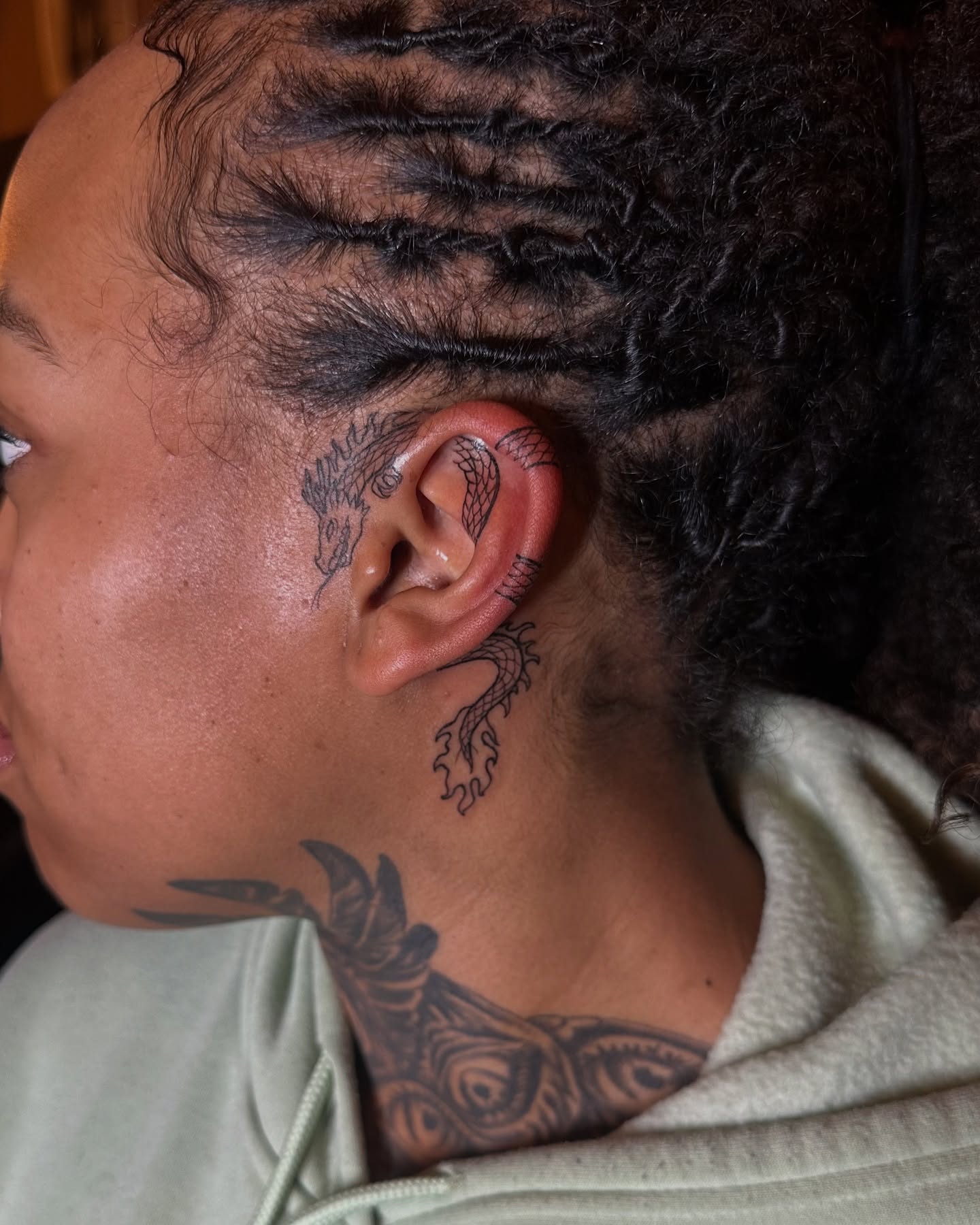 Dragon neo-traditional tattoo on the neck by Jevon Glasco Tattoos