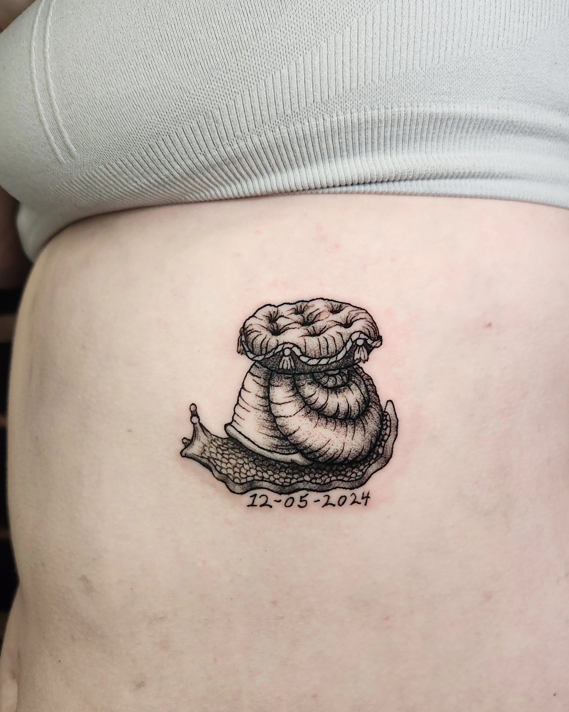 Snail black and grey tattoo on the thigh by Perry