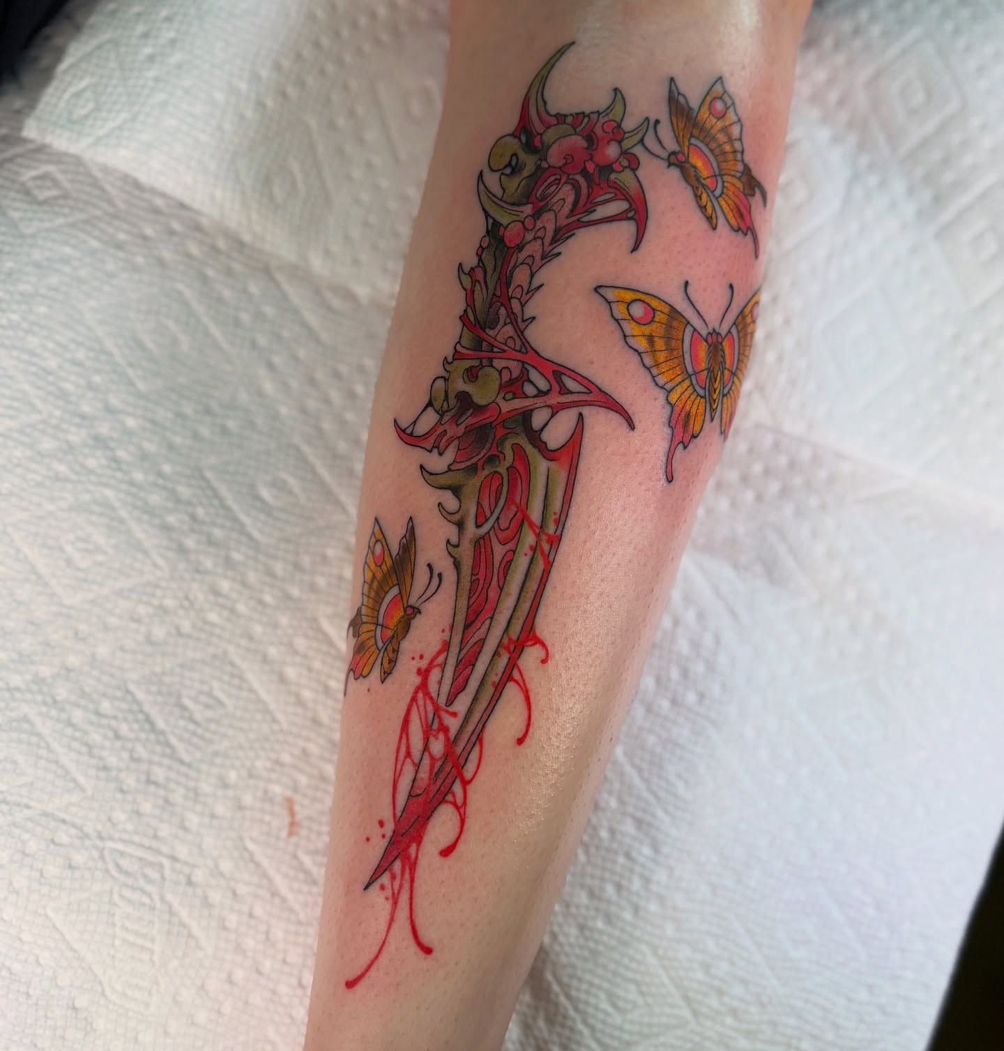 Dragon and butterflies neo-traditional tattoo on the forearm by Scott Kulikowski