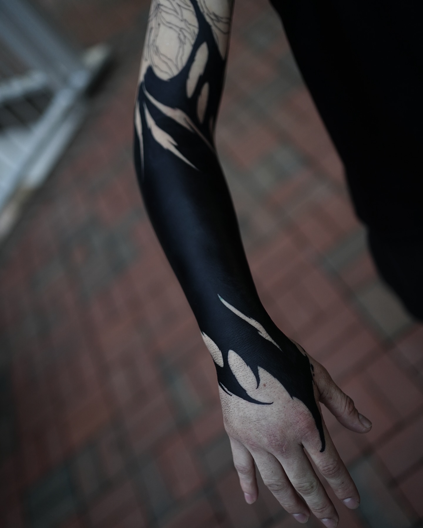 Abstract flame black and grey tattoo on the forearm by Chris galvis, Charlotte, North Carolina