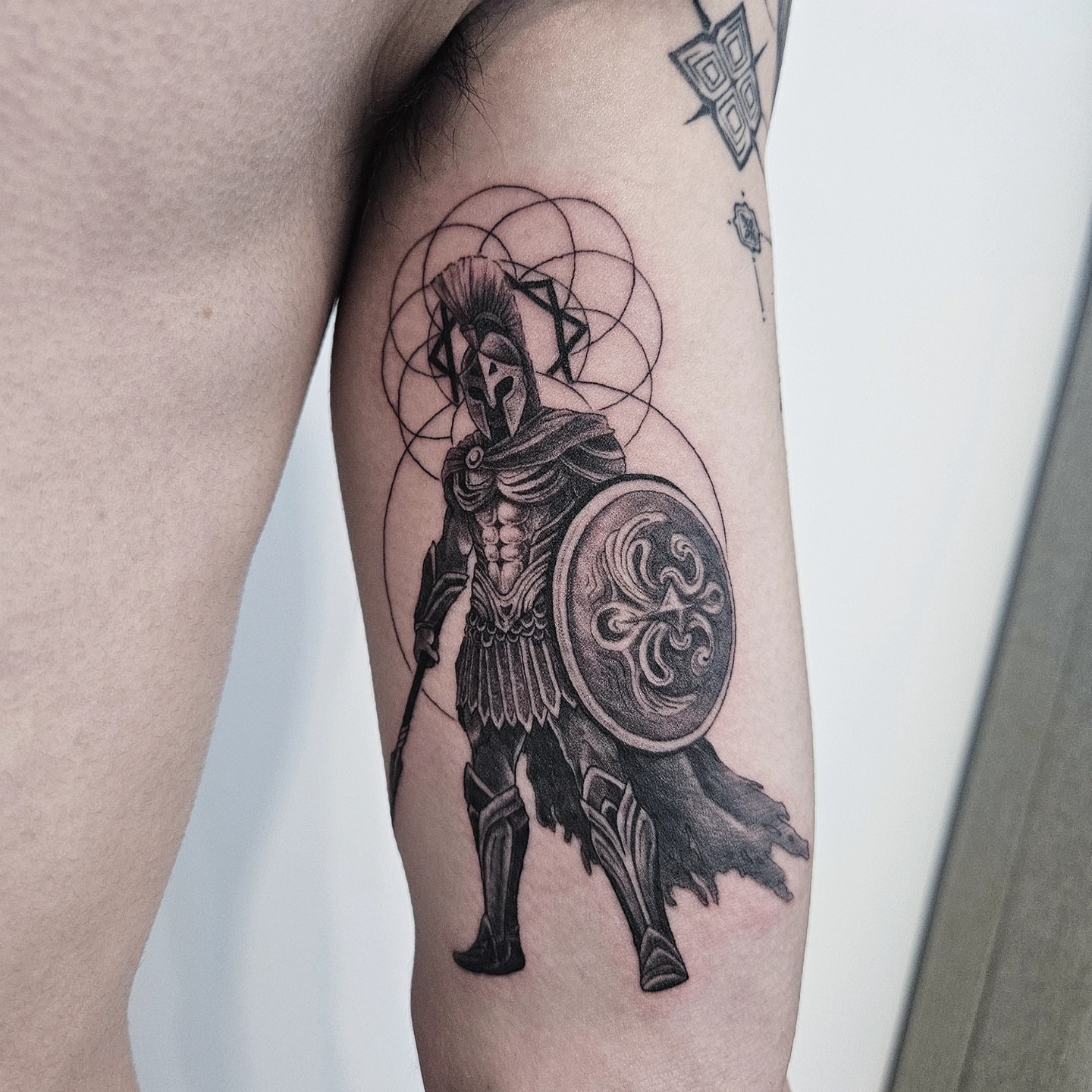 Spartan warrior geometric tattoo on the forearm by Tattooer Hermin 허민