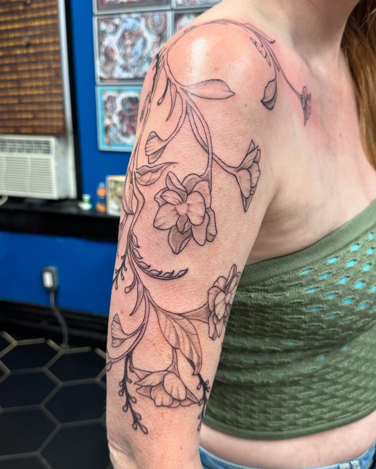 Floral design black and grey tattoo on the upper arm by Shannon, Cincinnati, Ohio
