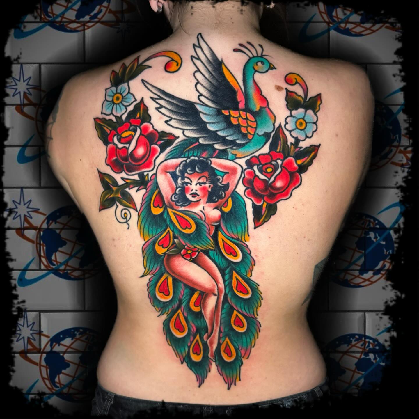Peacock and woman American traditional tattoo on the back by Antonio DeCaro