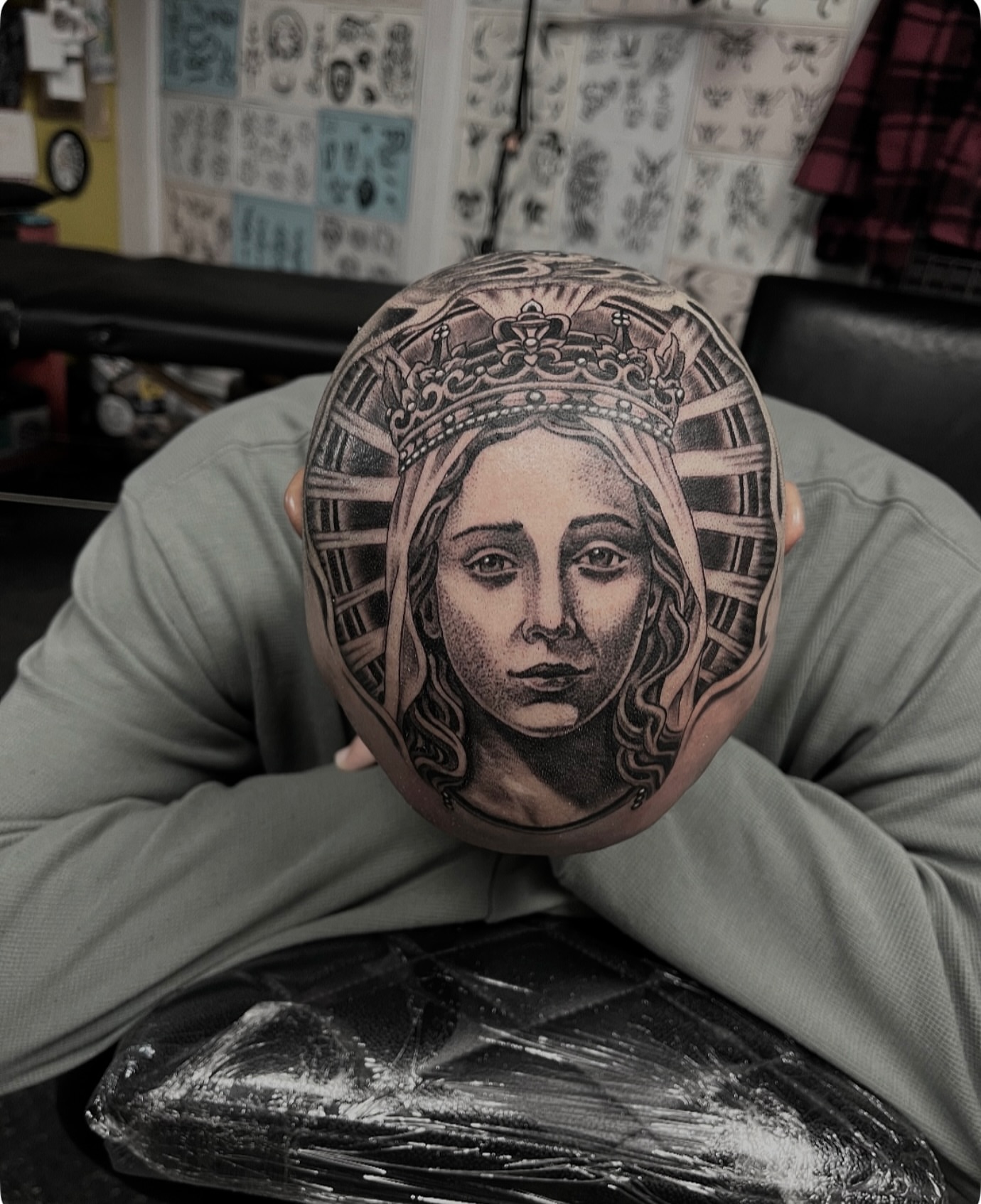 Woman with crown dotwork tattoo on the head by Graham Niles