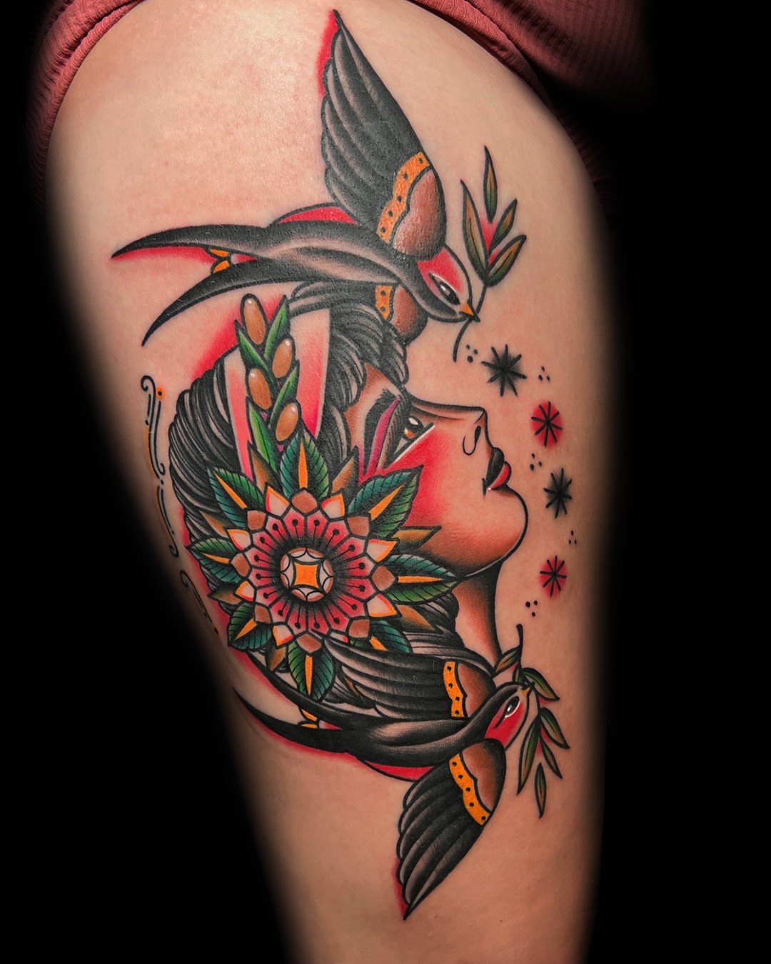 Woman with birds and flowers American traditional tattoo on the thigh by Massimiliano pennella