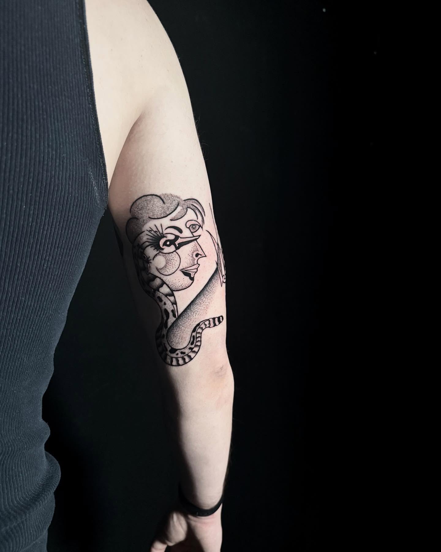 Woman with snake dotwork tattoo on the forearm by Alex Richardson