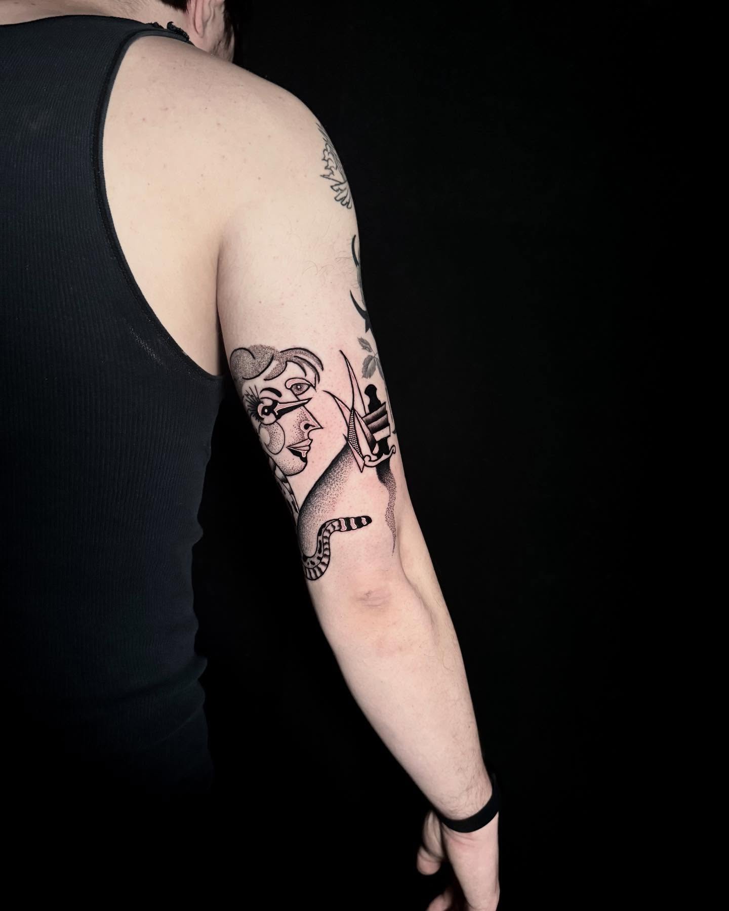 Woman with sword black and grey tattoo on the forearm by Alex Richardson