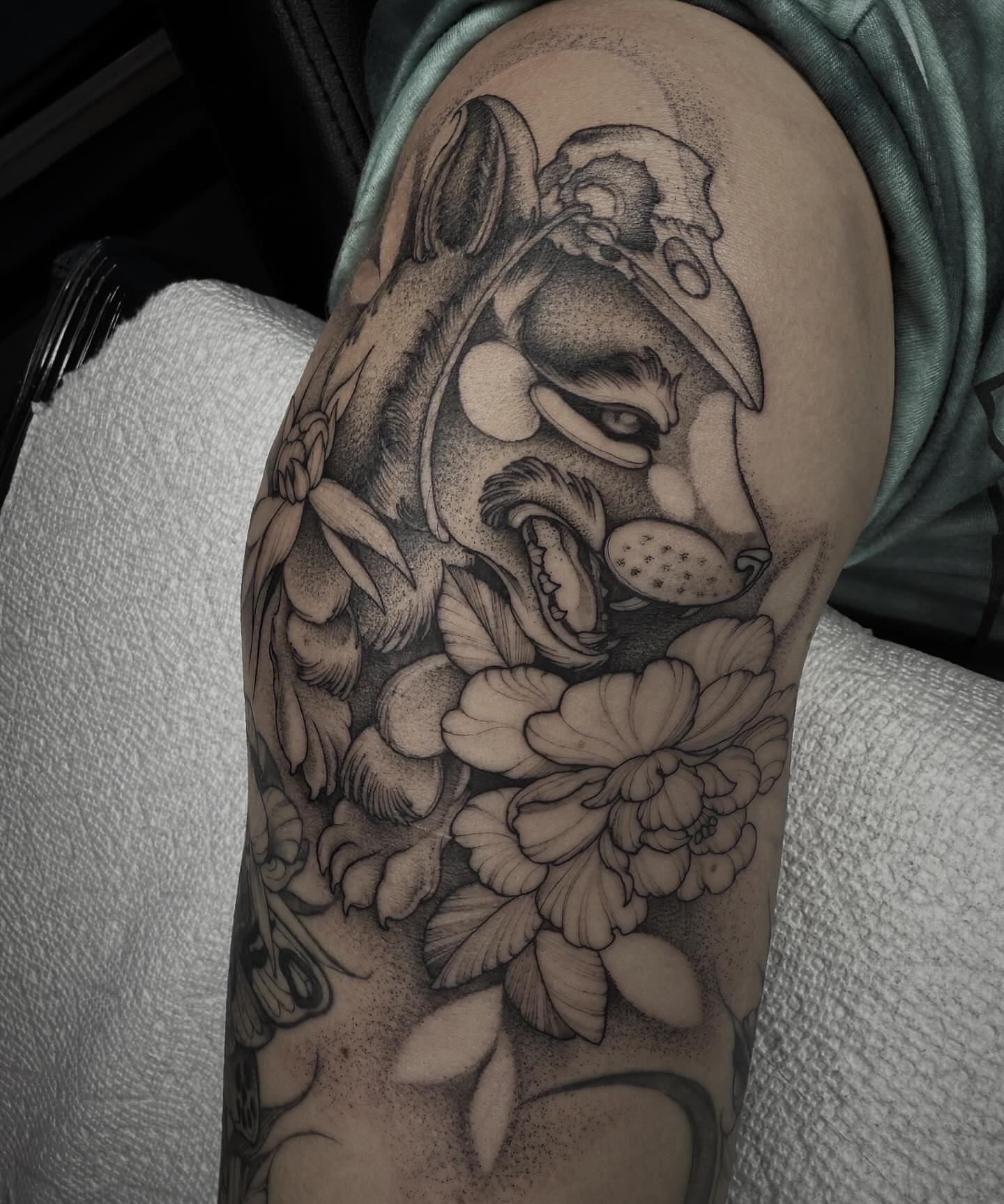 Lion and flowers dotwork tattoo on the upper arm by π· C a t B l a c k π·οΈ