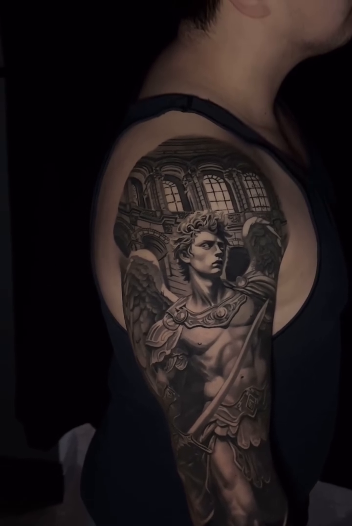 Angel with sword and shield realism tattoo by Travis Chick