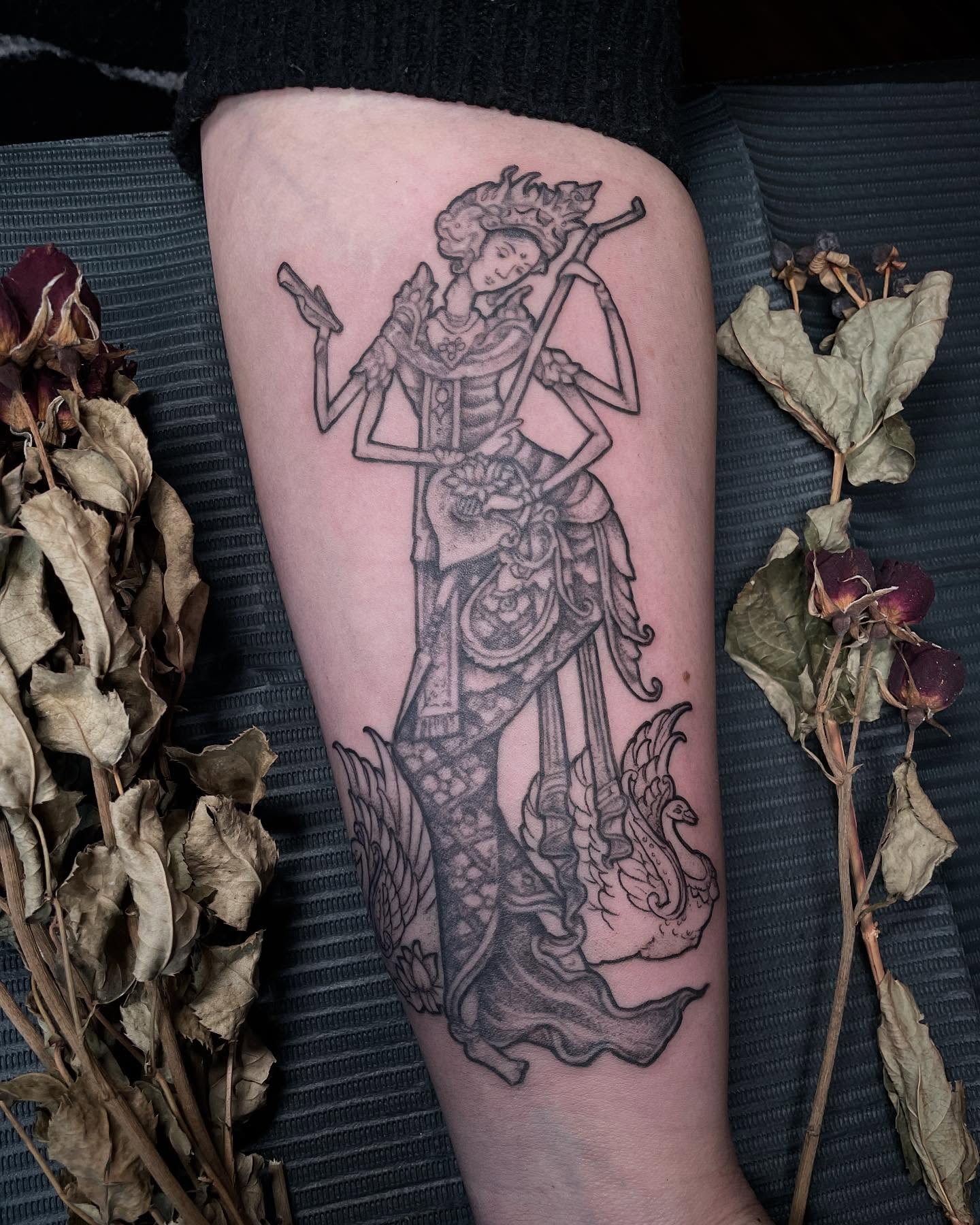 Woman with swan black and grey tattoo on the forearm by Jamie Draven 🐺