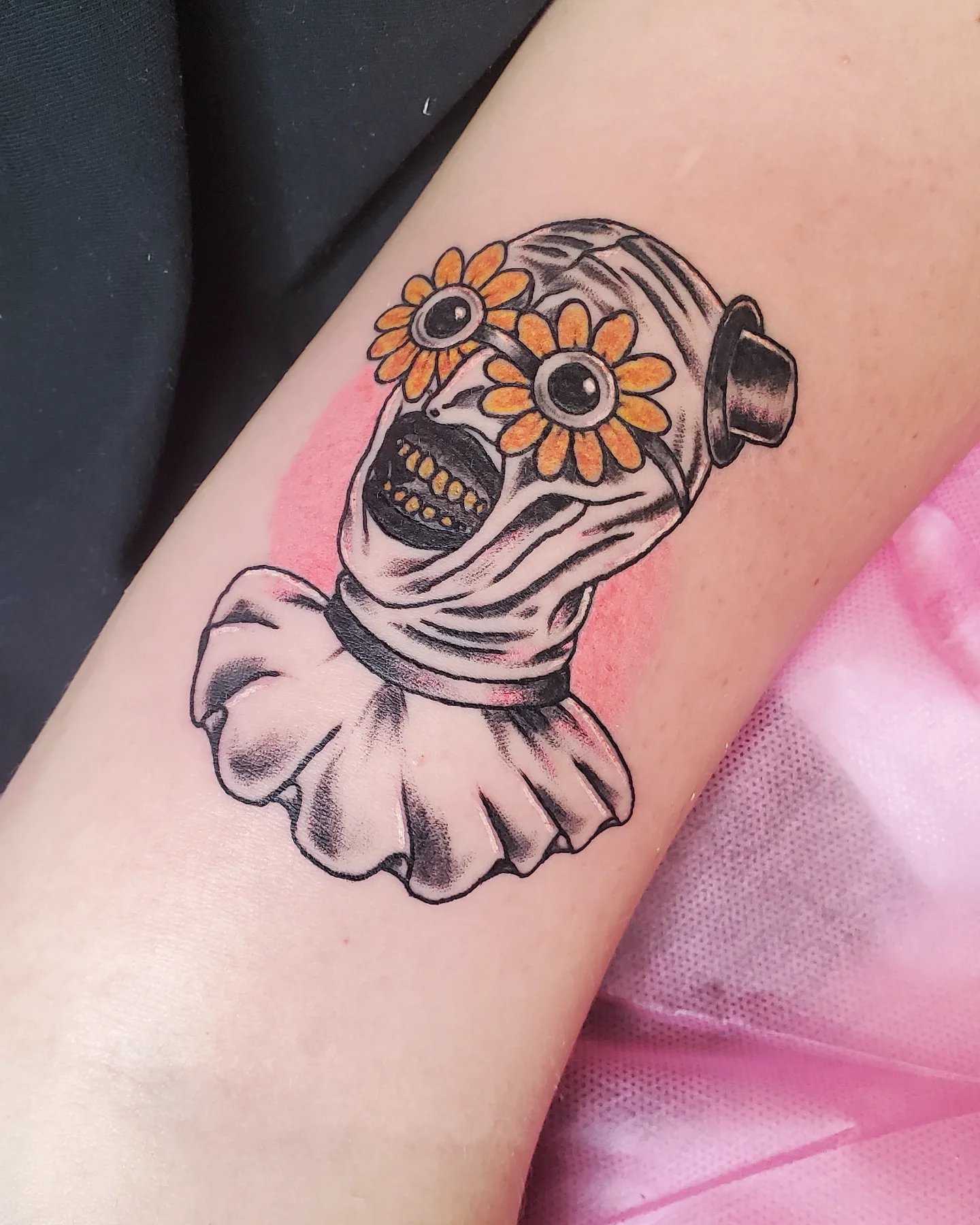 Mummy head with flowers American traditional tattoo on the forearm by Sum'er Daize Tattoos
