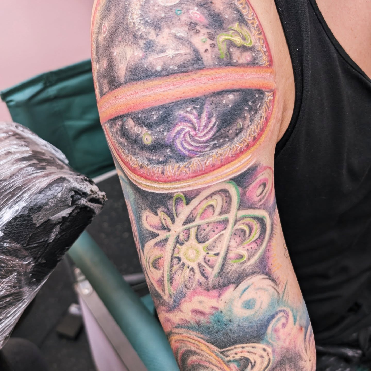 Galaxy and abstract patterns dotwork tattoo on the forearm by Markus Hicks