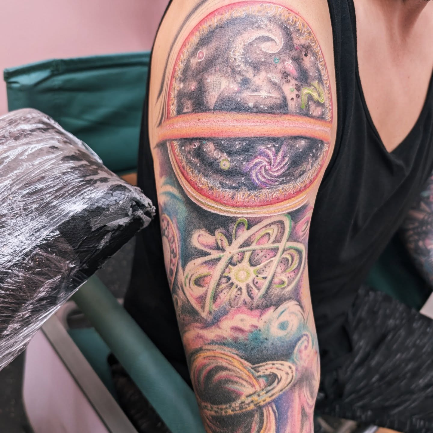 Galactic cosmic scene realism tattoo on the upper arm by Markus Hicks