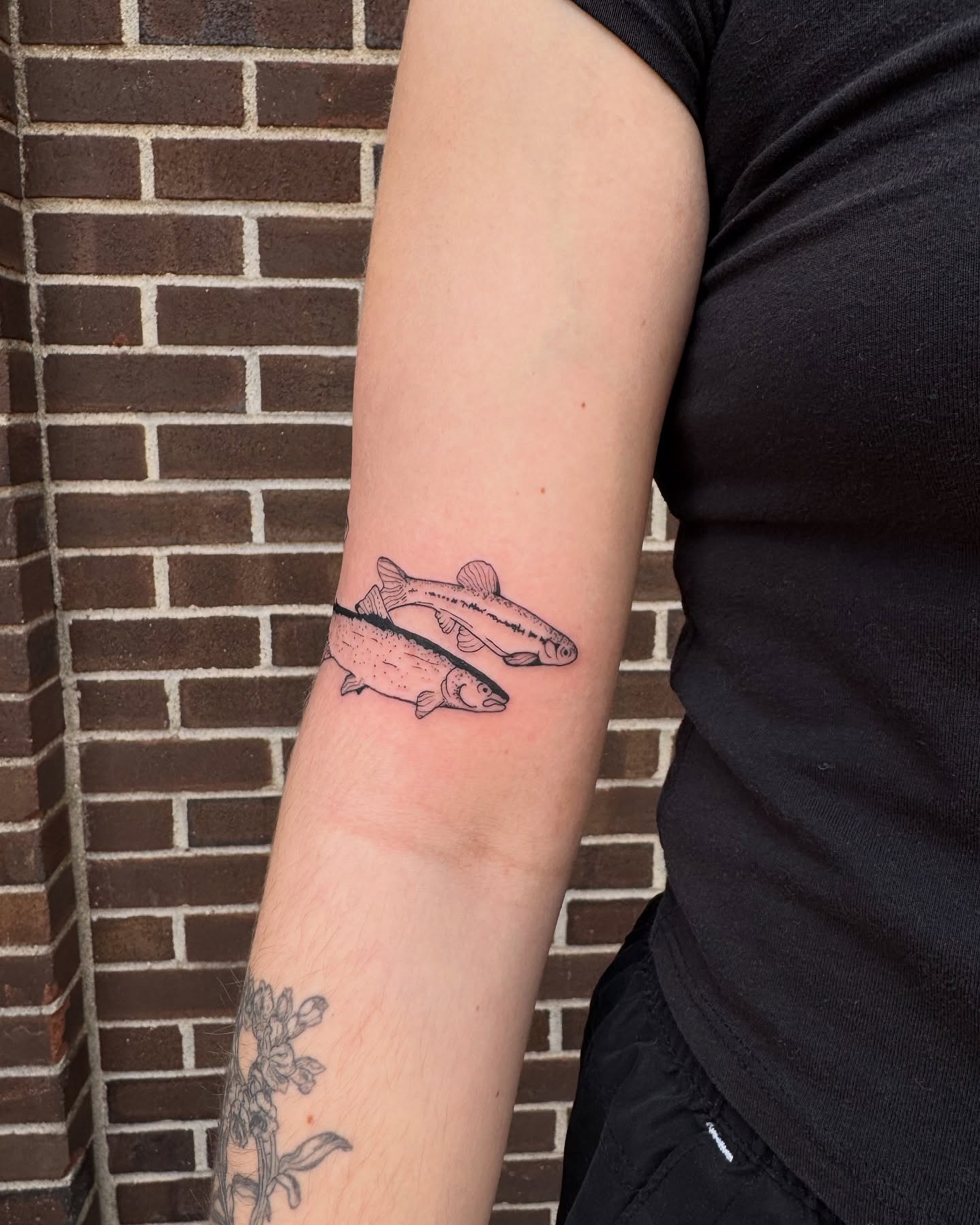 Salmon realism tattoo on the forearm by Milo