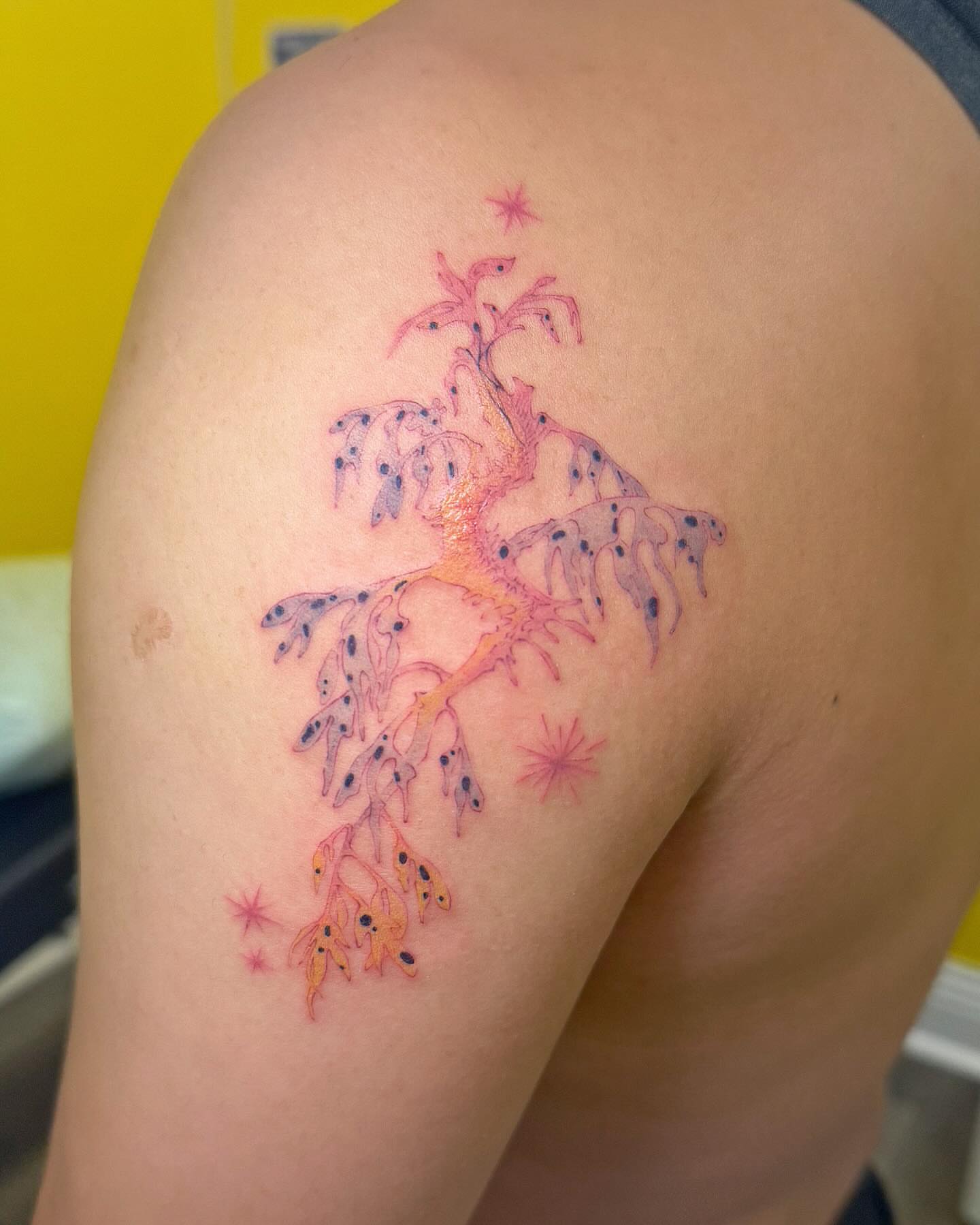 Abstract plant dotwork tattoo on the shoulder by Echo