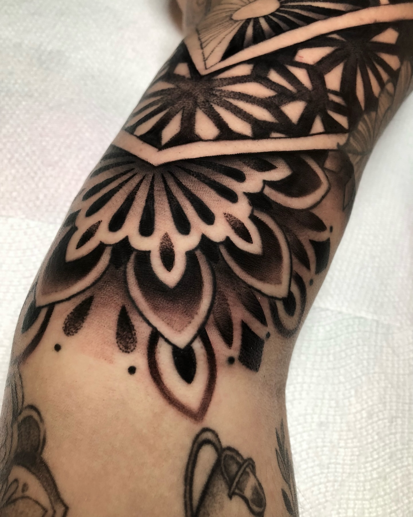 Geometric pattern geometric tattoo on the forearm by Melissa Brown