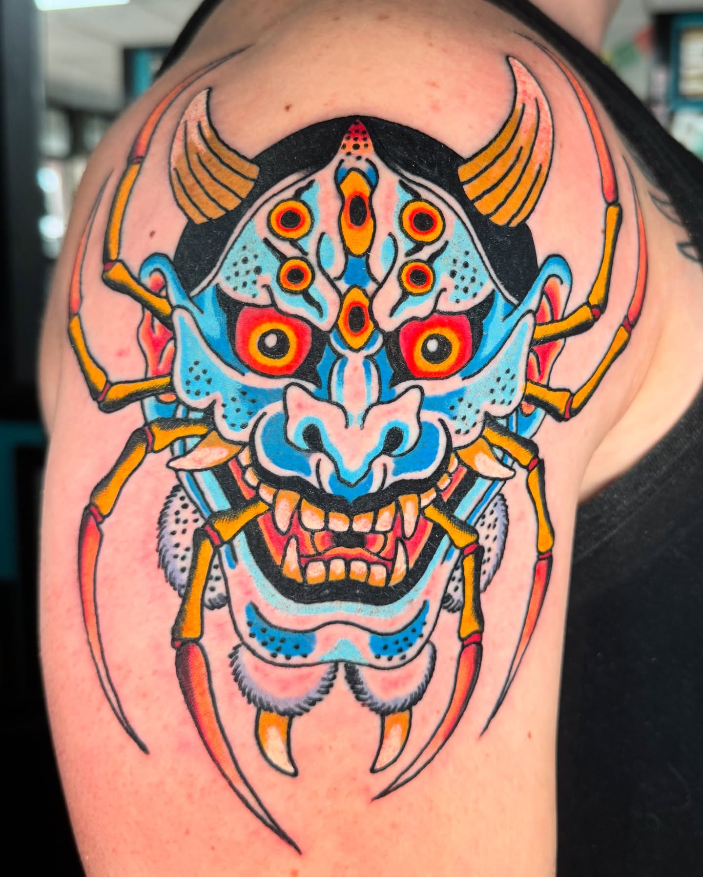 Mask American traditional tattoo on the shoulder by Timothy Wood