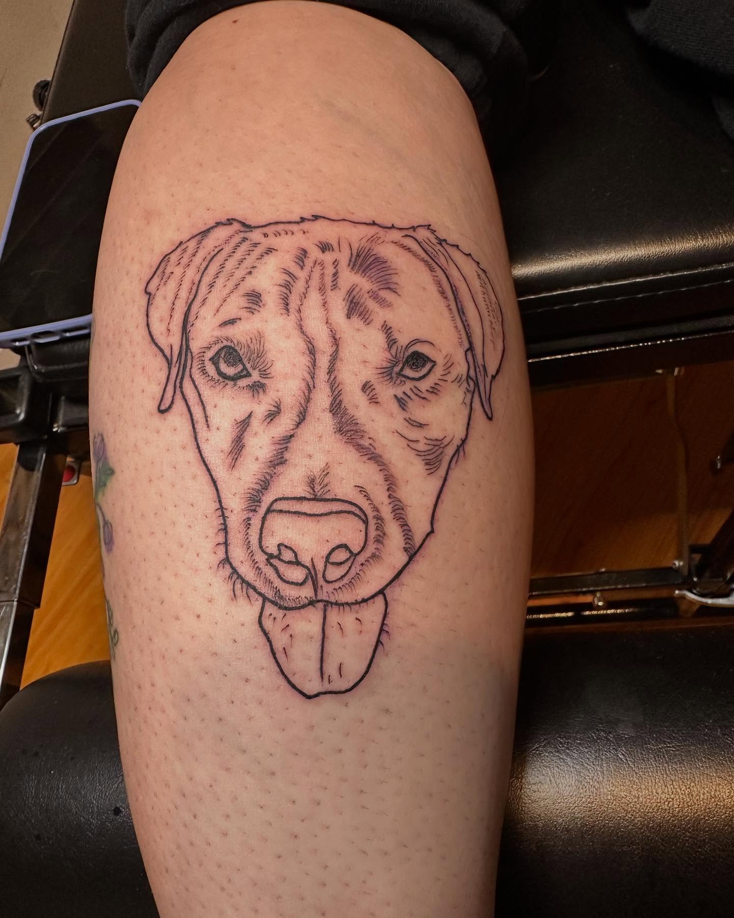 Dog realism tattoo on the thigh by Jason Topliss
